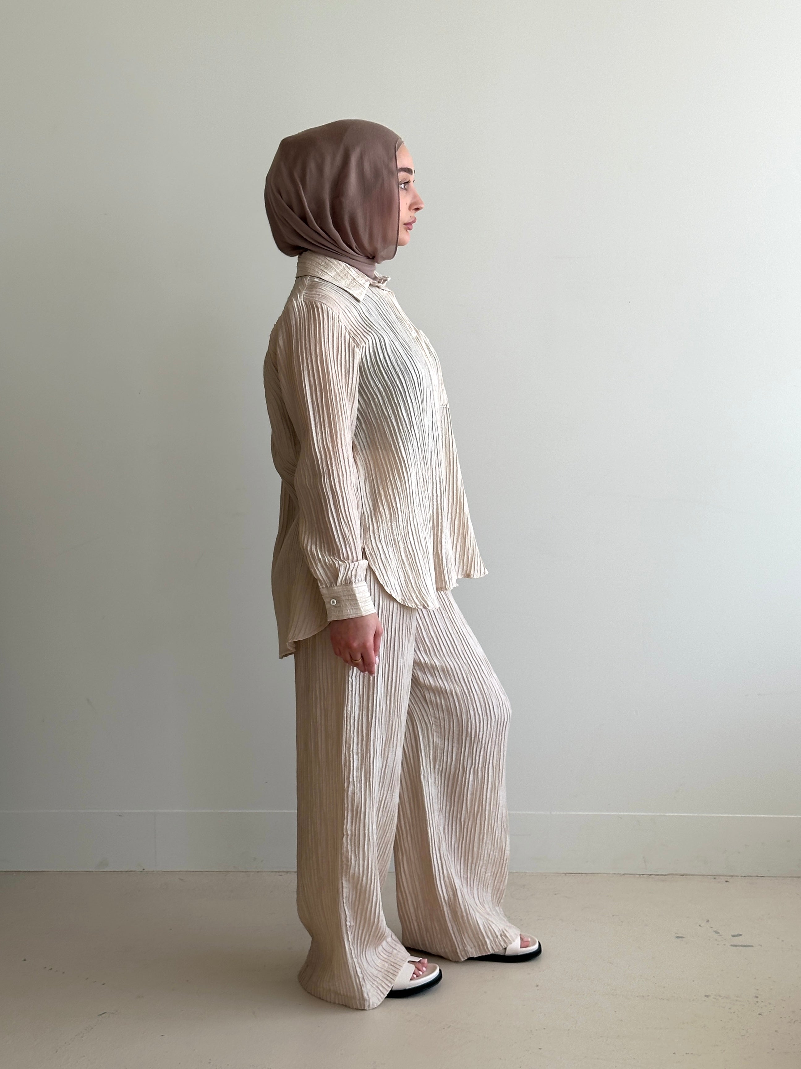 women's 2 piece modest fashion summer set, co-ord includes button up long sleeve shirt with matching loose pant. fabrication is crinkled, lightweight and breathable for summer. can wear it everyday, to work, brunch, picnic and can be transformed to a night outfit to wear with heels and dress it more up for dinner dates.