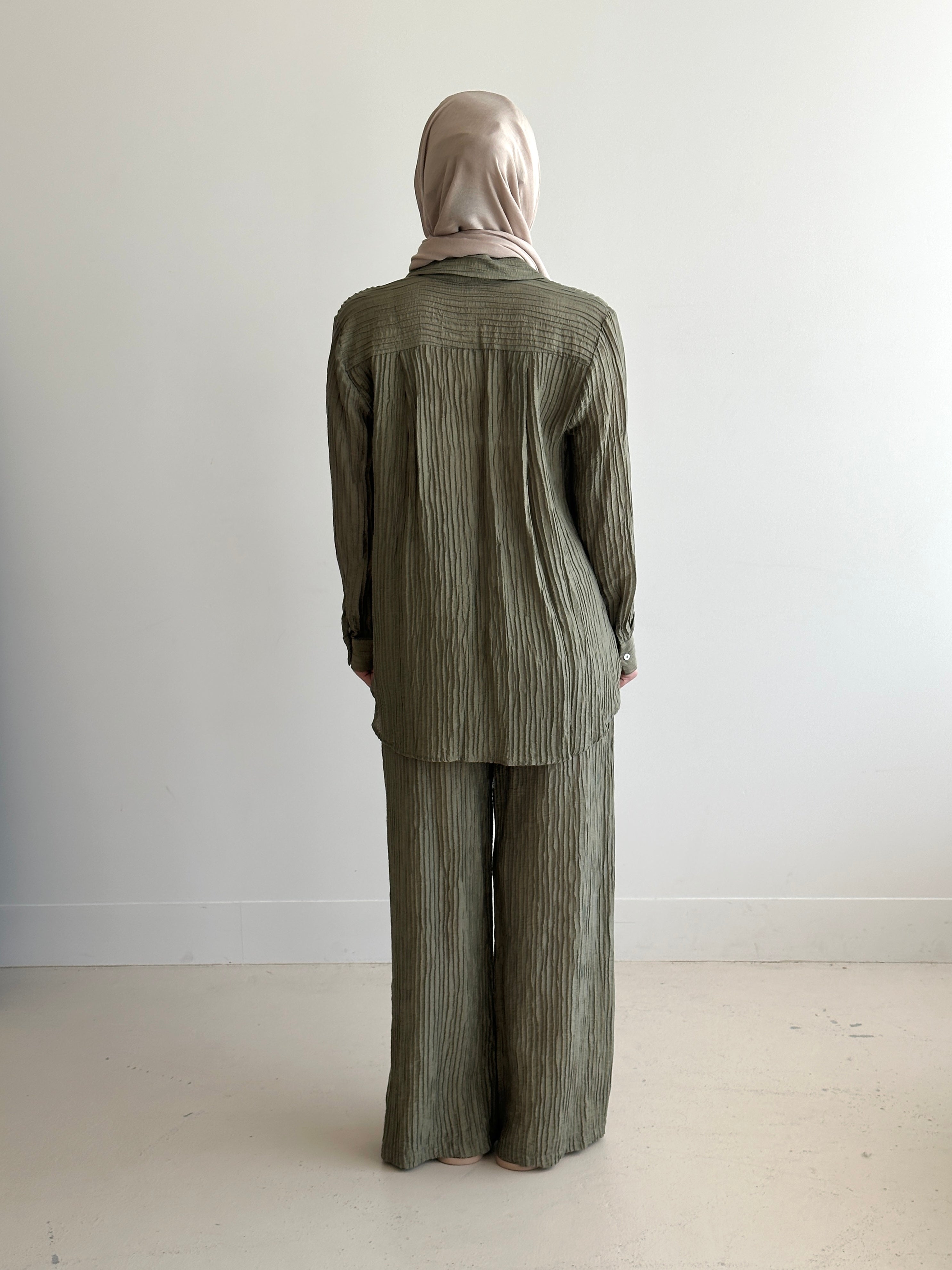 women's 2 piece modest fashion summer set, co-ord includes button up long sleeve shirt with matching loose pant. fabrication is crinkled, lightweight and breathable for summer. can wear it everyday, to work, brunch, picnic and can be transformed to a night outfit to wear with heels and dress it more up for dinner dates.