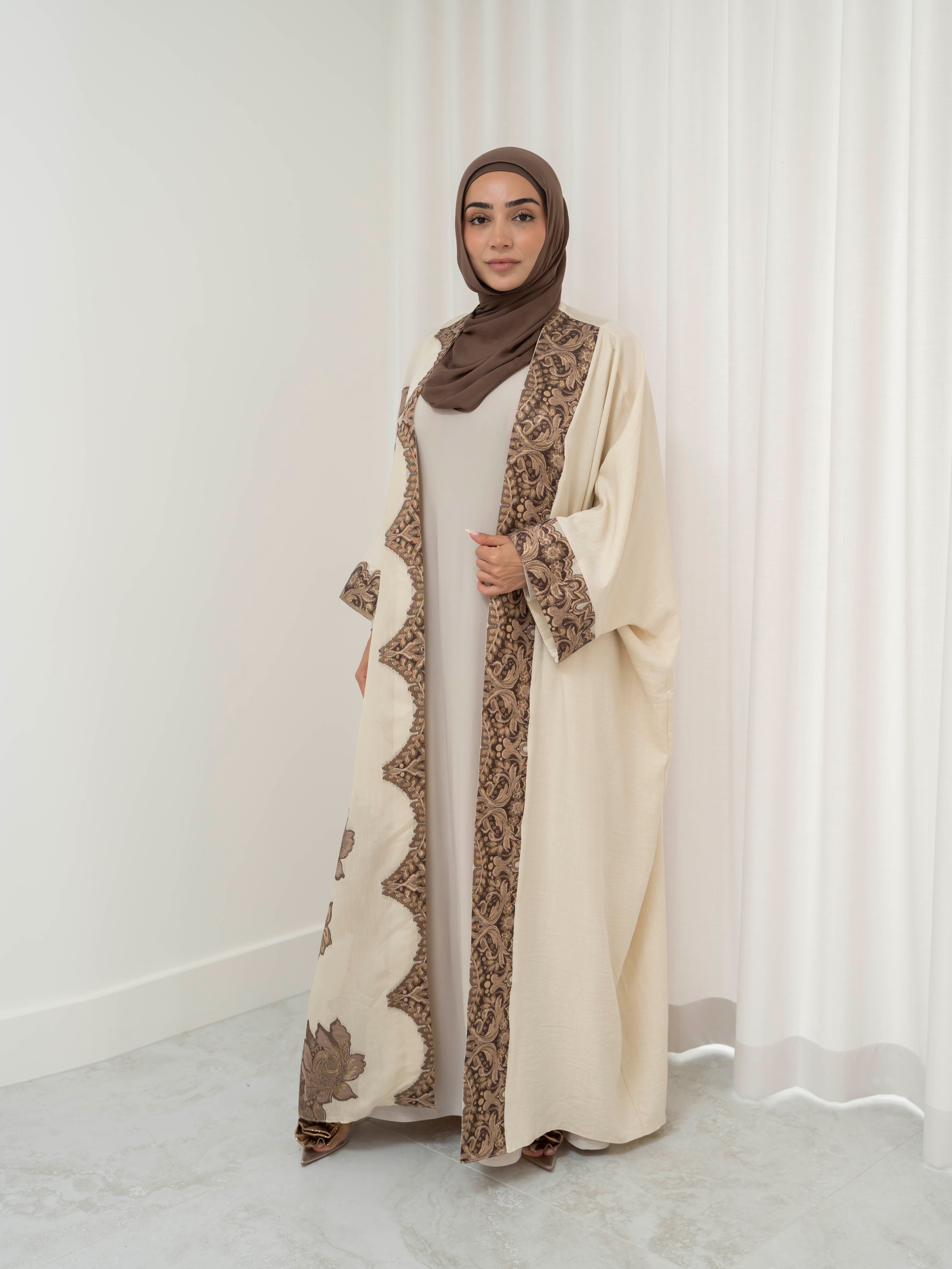 Model wearing the Heritage Luxe open abaya featuring an elegant open-front silhouette with refined detailing, styled for a modest and luxurious look suitable for Ramadan and Eid.