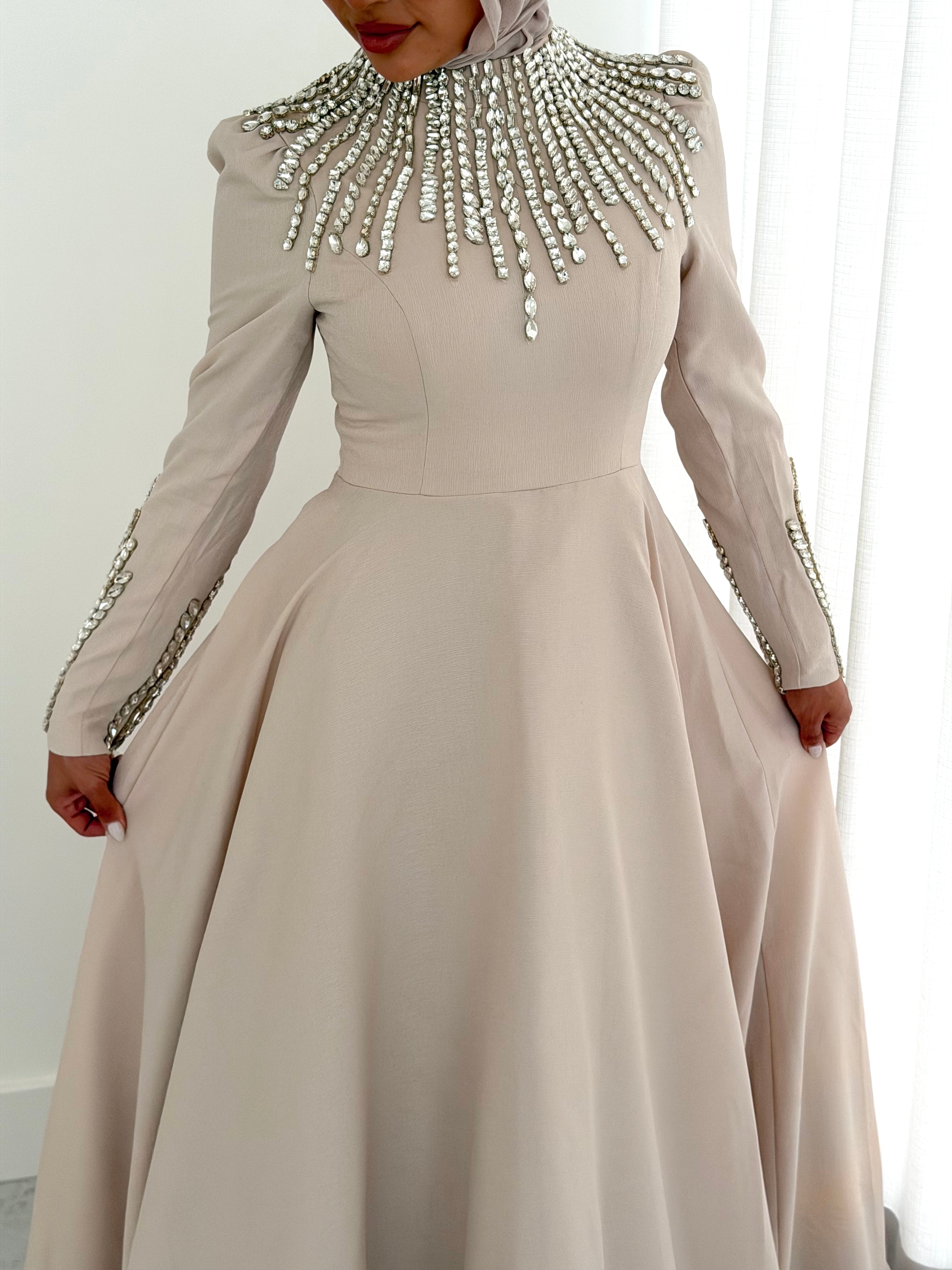 women's formal dress- maxi, full length with long sleeves and offers modest coverage with gold embellishment. Suitable to wear for occasions, engagement, wedding, formals etc.