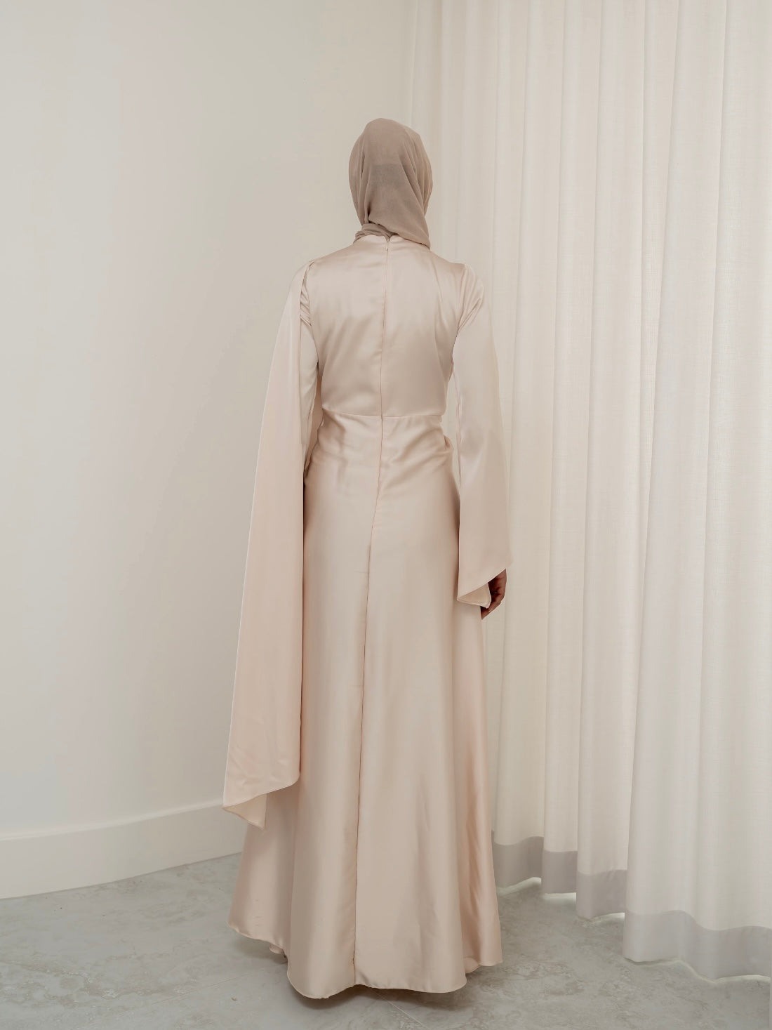 Step into effortless elegance with the Aurora Drape Formal Dress. This stunning piece features an expertly crafted draped design that gathers beautifully at the waist, accentuating your figure while creating a graceful, flowing silhouette.