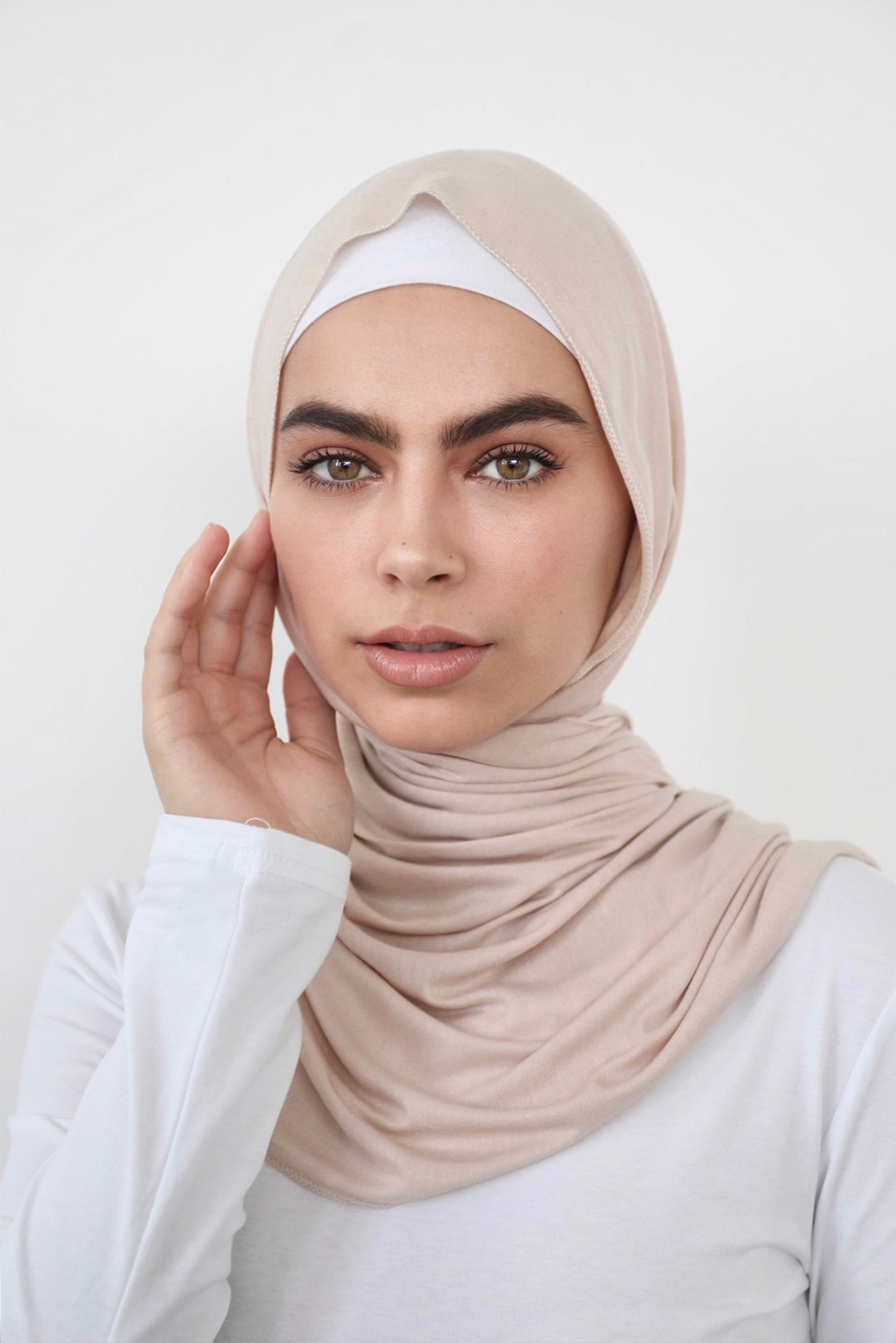 Signature jersey scarf made from soft, stretchy cotton with an extended length for easy wrapping and a secure, comfortable fit around the head.