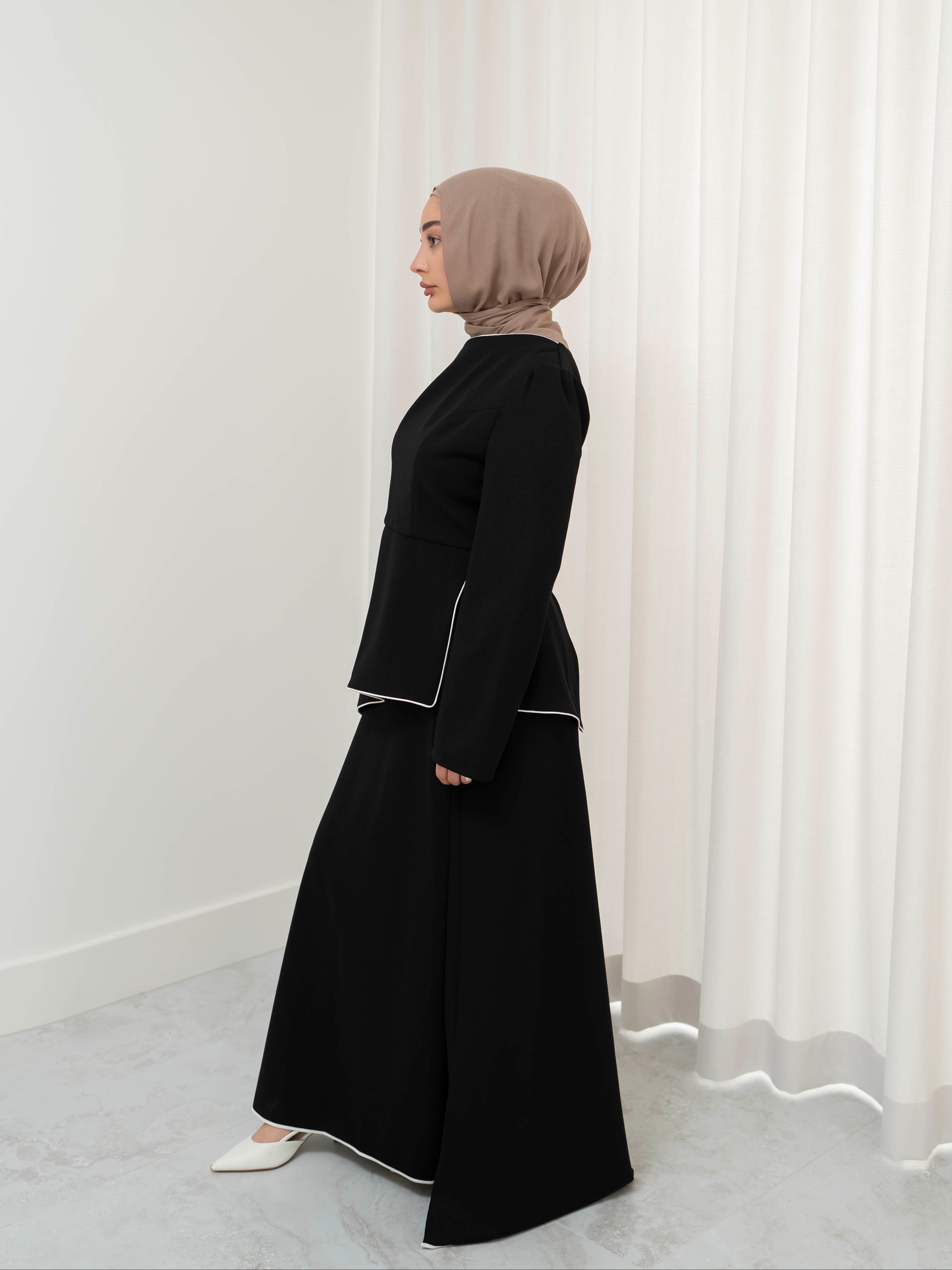 Two-piece modest set with a structured top and coordinating draped bottom, creating a flattering, elongated silhouette. Polished yet comfortable, perfect for special occasions or all-day wear.