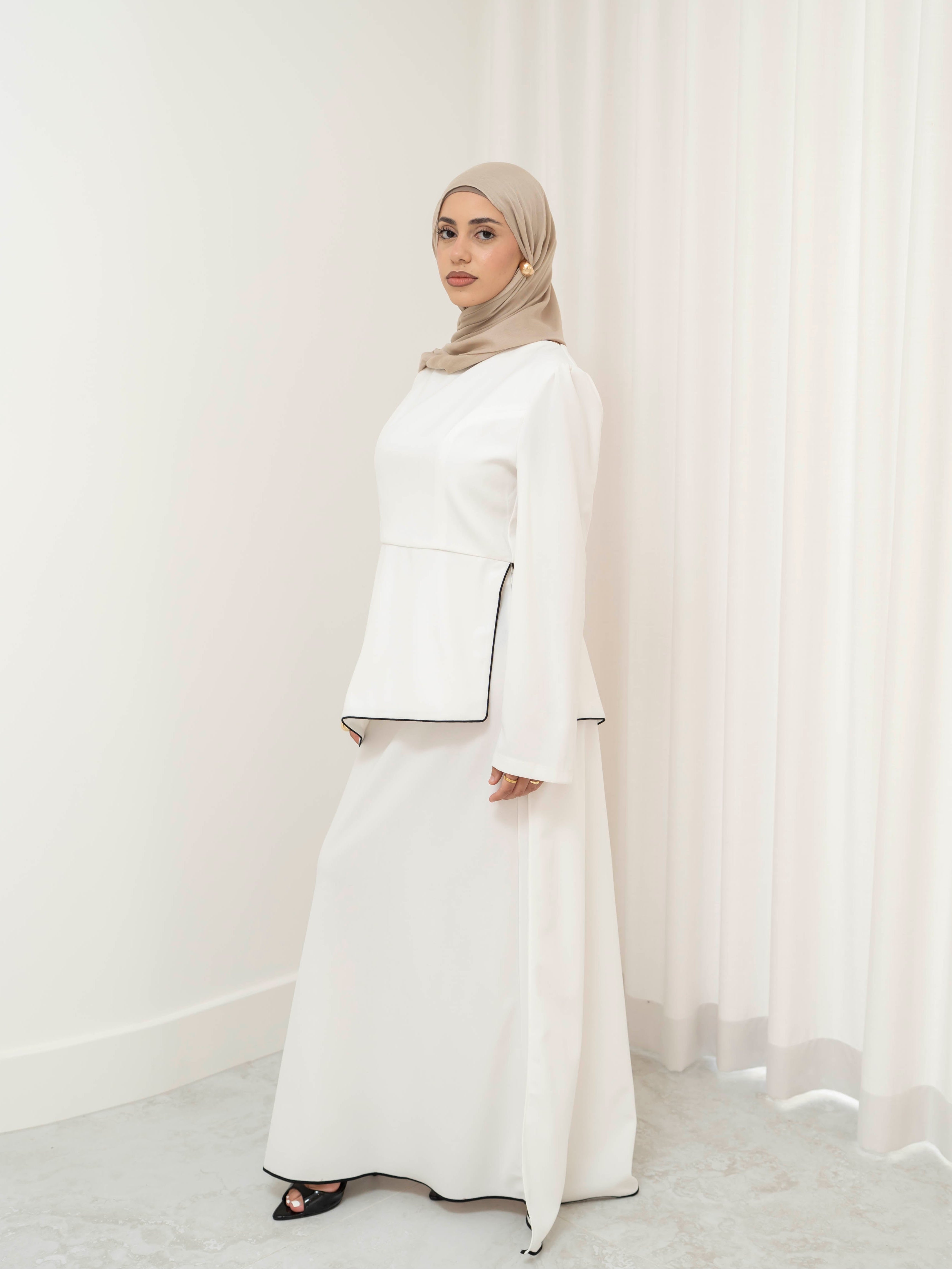 Two-piece modest set with a structured top and coordinating draped bottom, creating a flattering, elongated silhouette. Polished yet comfortable, perfect for special occasions or all-day wear.