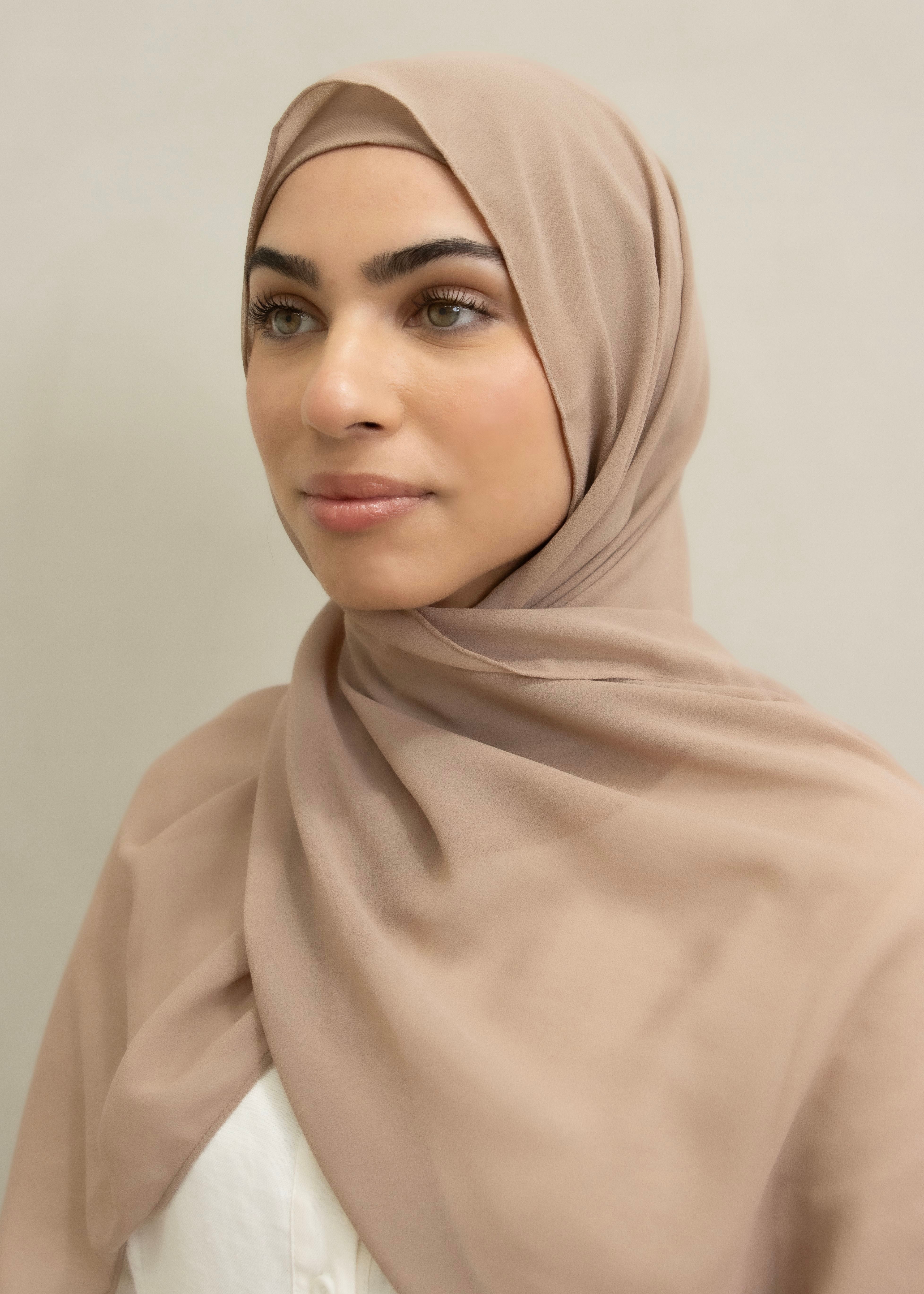 Signature crepe hijab with a soft, flowy drape and slightly higher opacity than chiffon. Features a non-slip finish for secure, comfortable all-day wear. Suitable for everyday use and special occasions. Includes matching open cotton undercap.