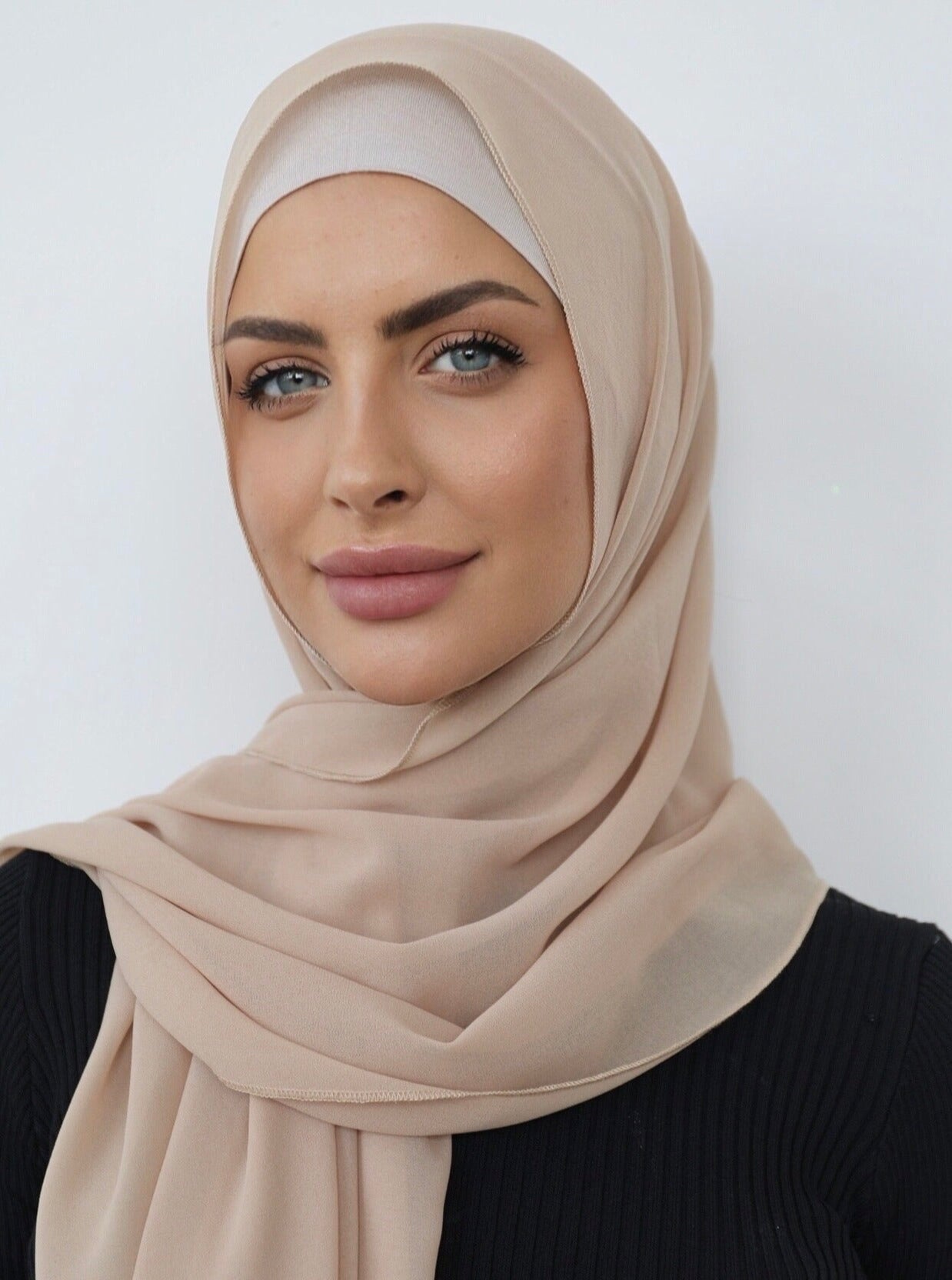 Signature crepe hijab with a soft, flowy drape and slightly higher opacity than chiffon. Features a non-slip finish for secure, comfortable all-day wear. Suitable for everyday use and special occasions. Includes matching open cotton undercap.