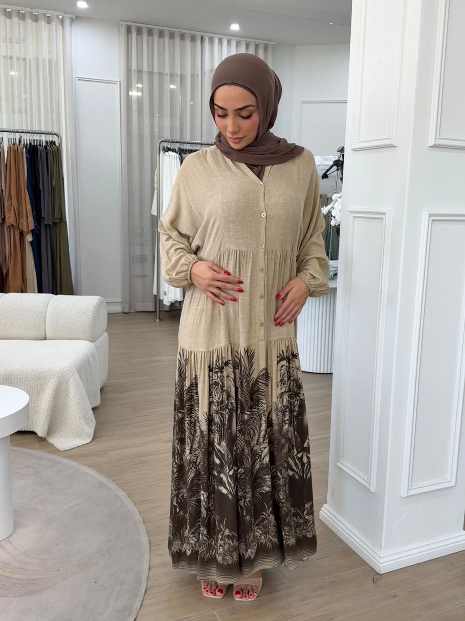 Crafted from breathable cotton, it offers a lightweight feel ideal for warm days while maintaining a modest, refined look.