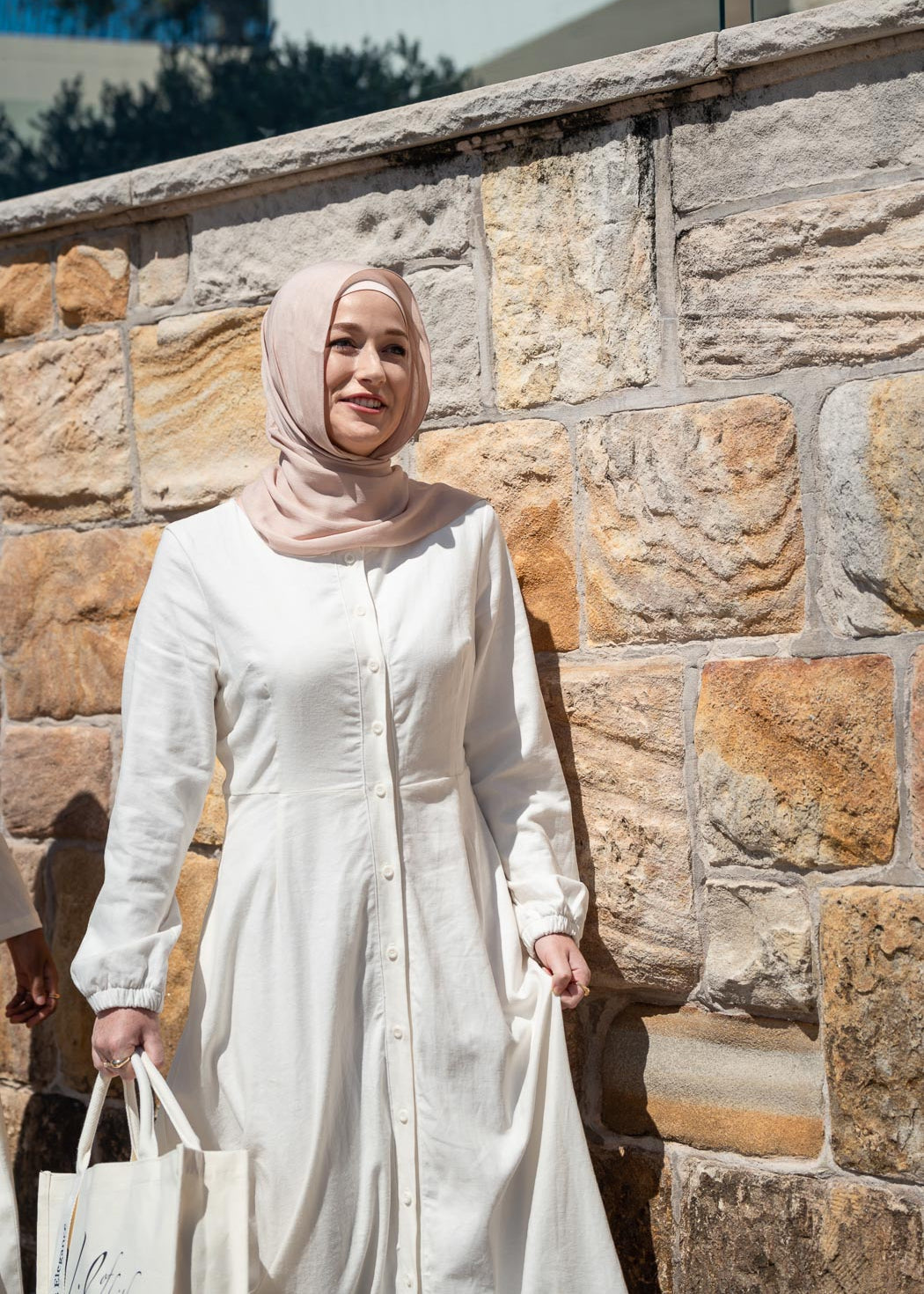 Ivory linen maxi dress with an A-line skirt and empire waist for a flattering silhouette. Features a round neckline and long balloon sleeves for an elegant touch. Lightweight and breathable, ideal for warm-weather wear and summer occasions.