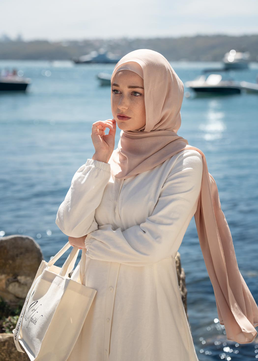 Ivory linen maxi dress with an A-line skirt and empire waist for a flattering silhouette. Features a round neckline and long balloon sleeves for an elegant touch. Lightweight and breathable, ideal for warm-weather wear and summer occasions.