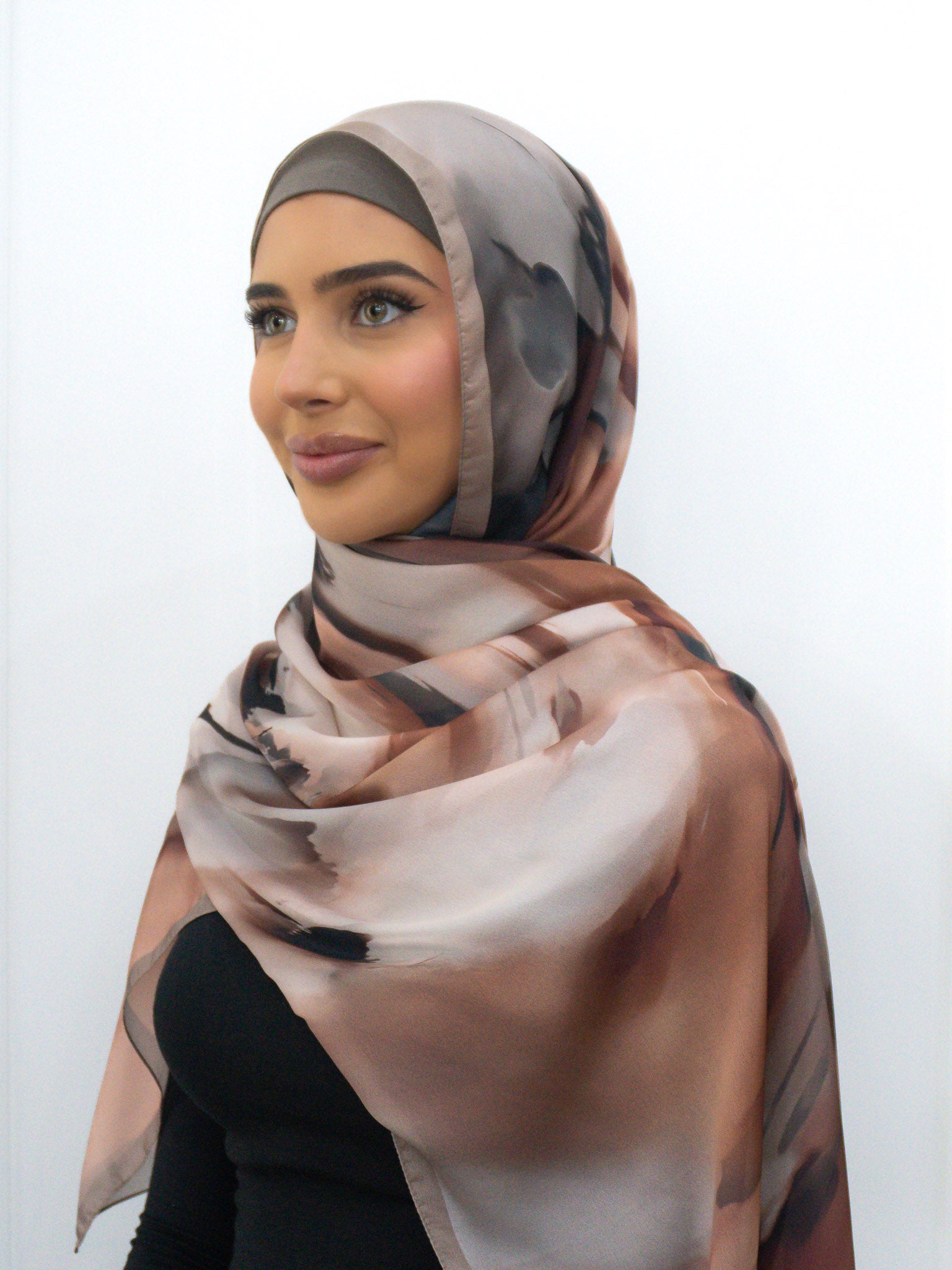 Silk Look printed hijab in lightweight satin-finish polyester with abstract border design, 68cm x 190cm.