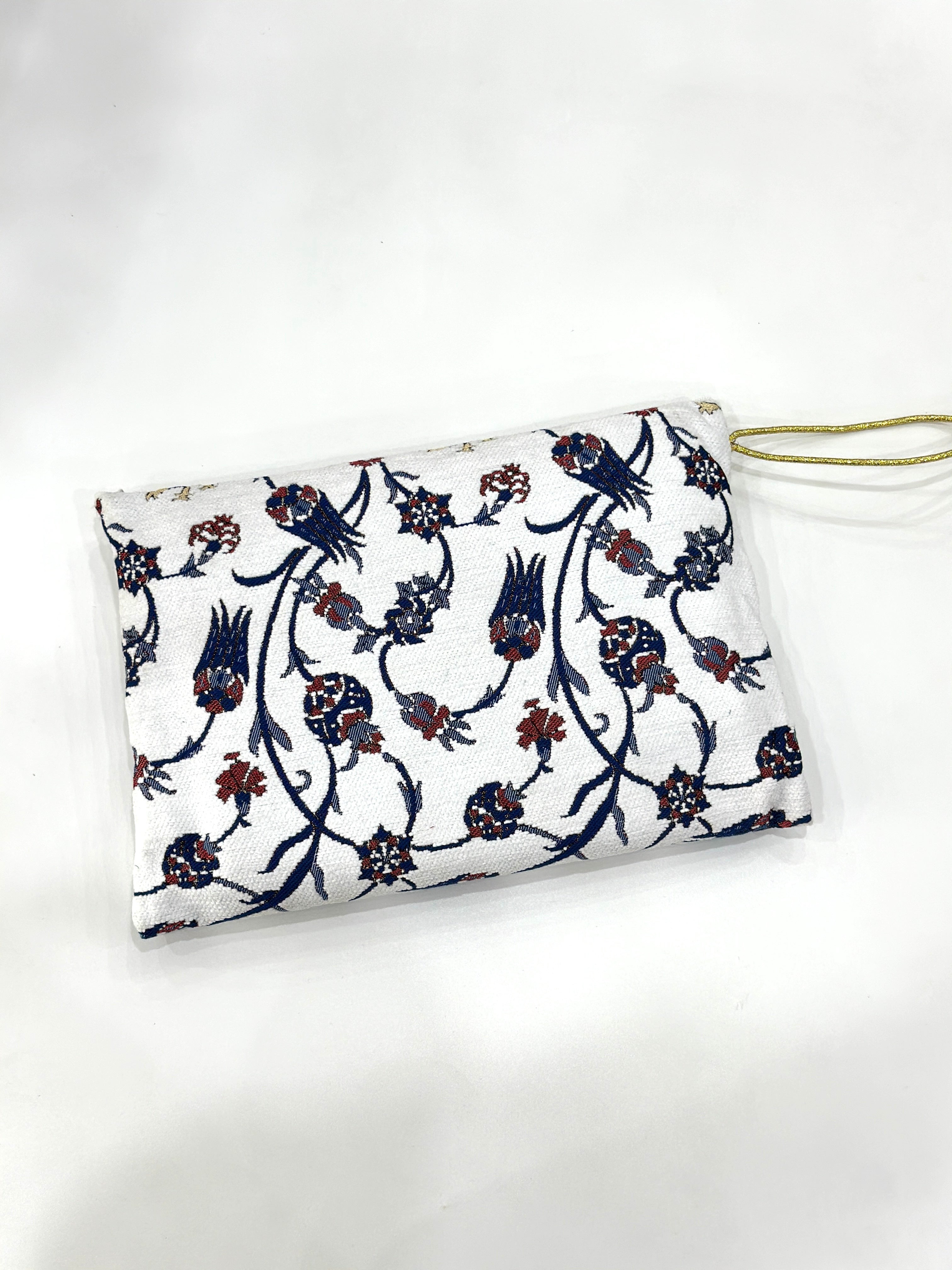 Embroidered Travel Prayer Mat with delicate embroidery, lightweight and portable for use on the go. Ideal for handbags, cars, work totes, or travel, providing a practical and elegant solution for performing salah anywhere.