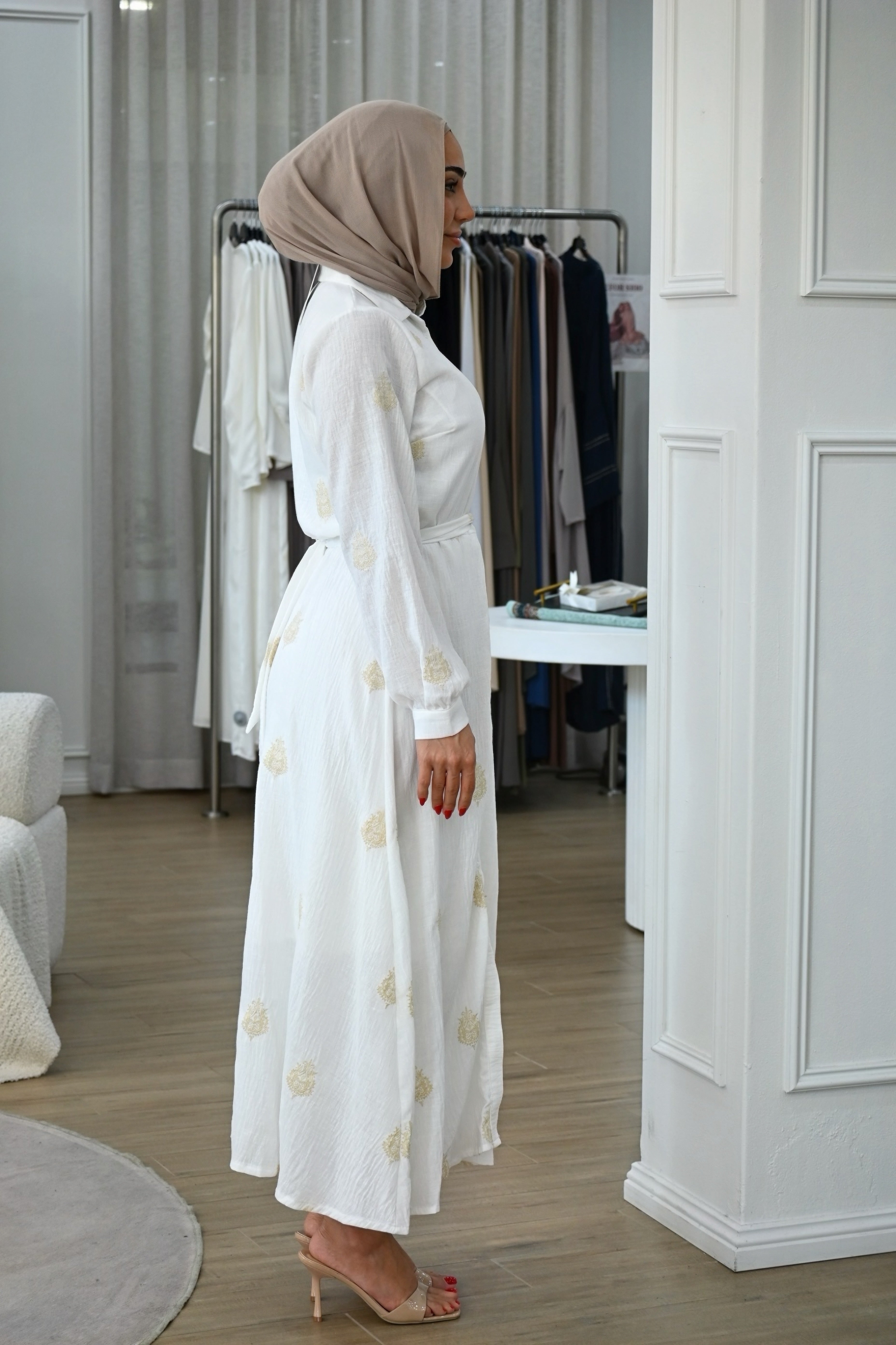 This embroidered shirt dress is designed for comfort without compromising on style. Crafted from a lightweight, breathable fabric, it features delicate tonal embroidery throughout for a refined, elevated finish