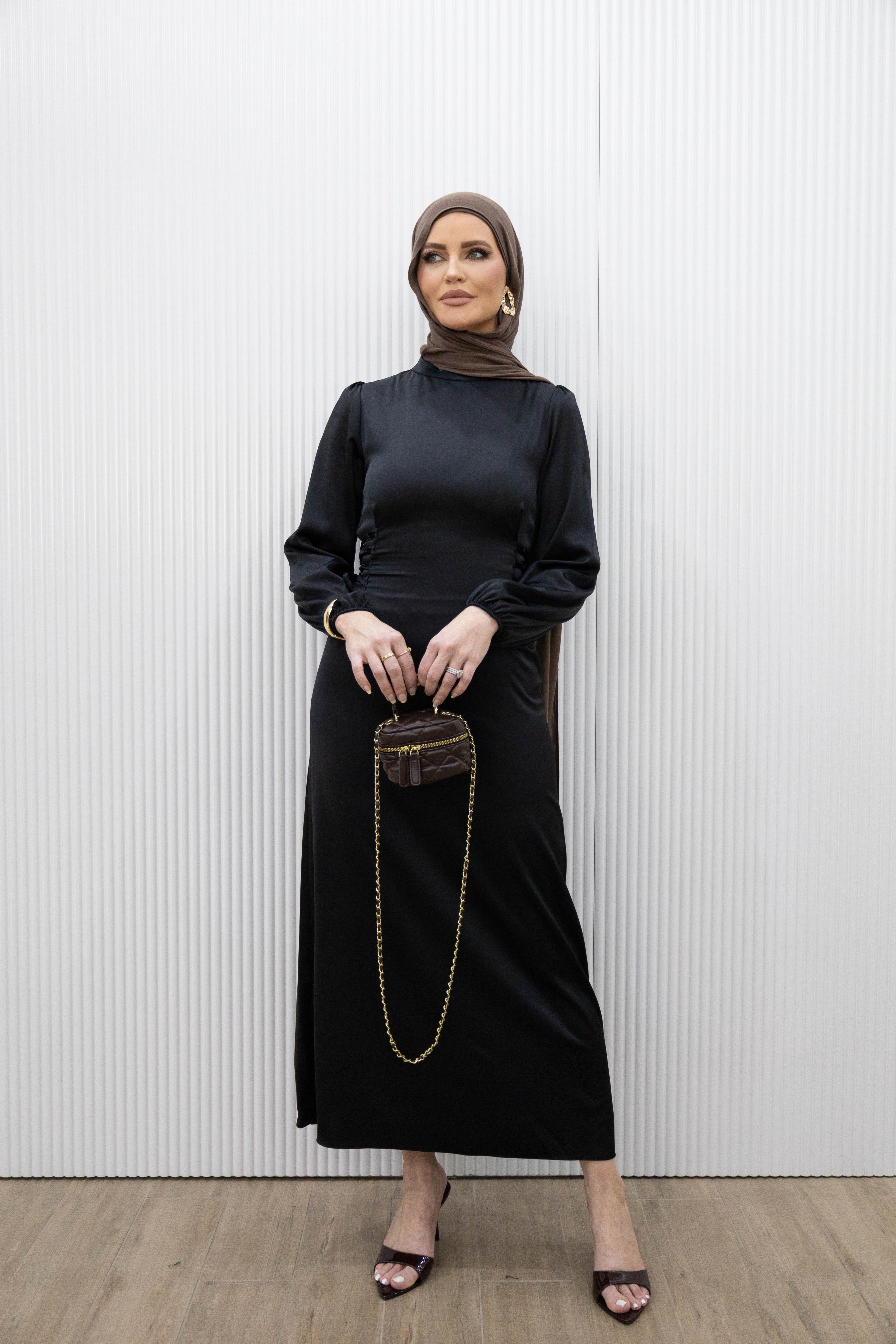 Channel an effortlessly simple elegance with our HANA SATIN DRESS. This midi dress boasts a fitted bodice and long blouson sleeves for a flattering silhouette. The lace ties at the back cinch in the waist, while the ankle length hem highlights a statement heel. Whether it's a dinner date or a girls night out, this dress is the perfect choice.