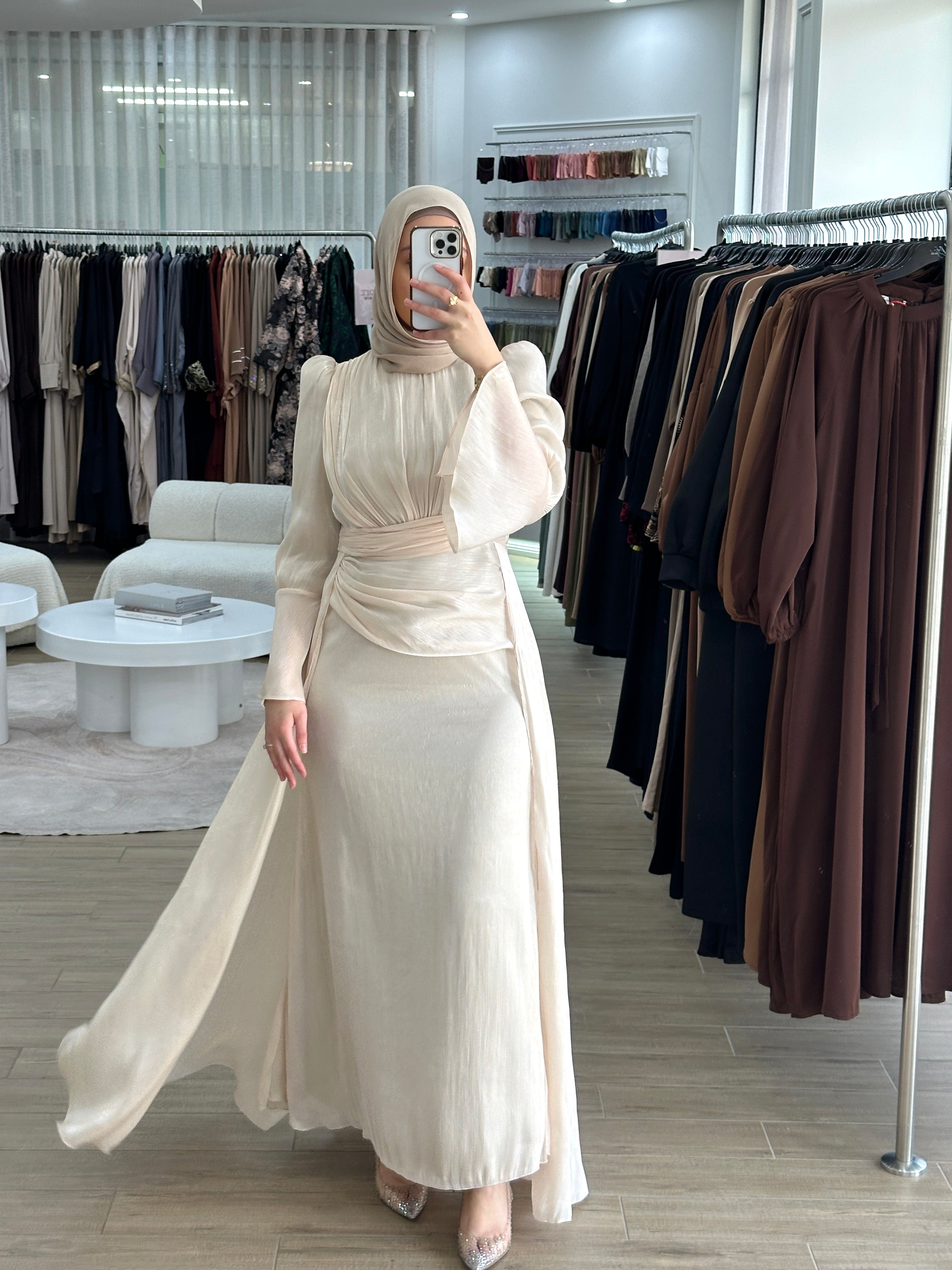 Lamis Formal Dress in shimmery chiffon featuring a ruched bodice with delicate pleat seams and an A-line skirt with flowing drape panels. Designed with long sleeves, fluted cuffs, a ruffled floor-length hem, invisible back zip, and full lining — perfect for elegant formal occasions.