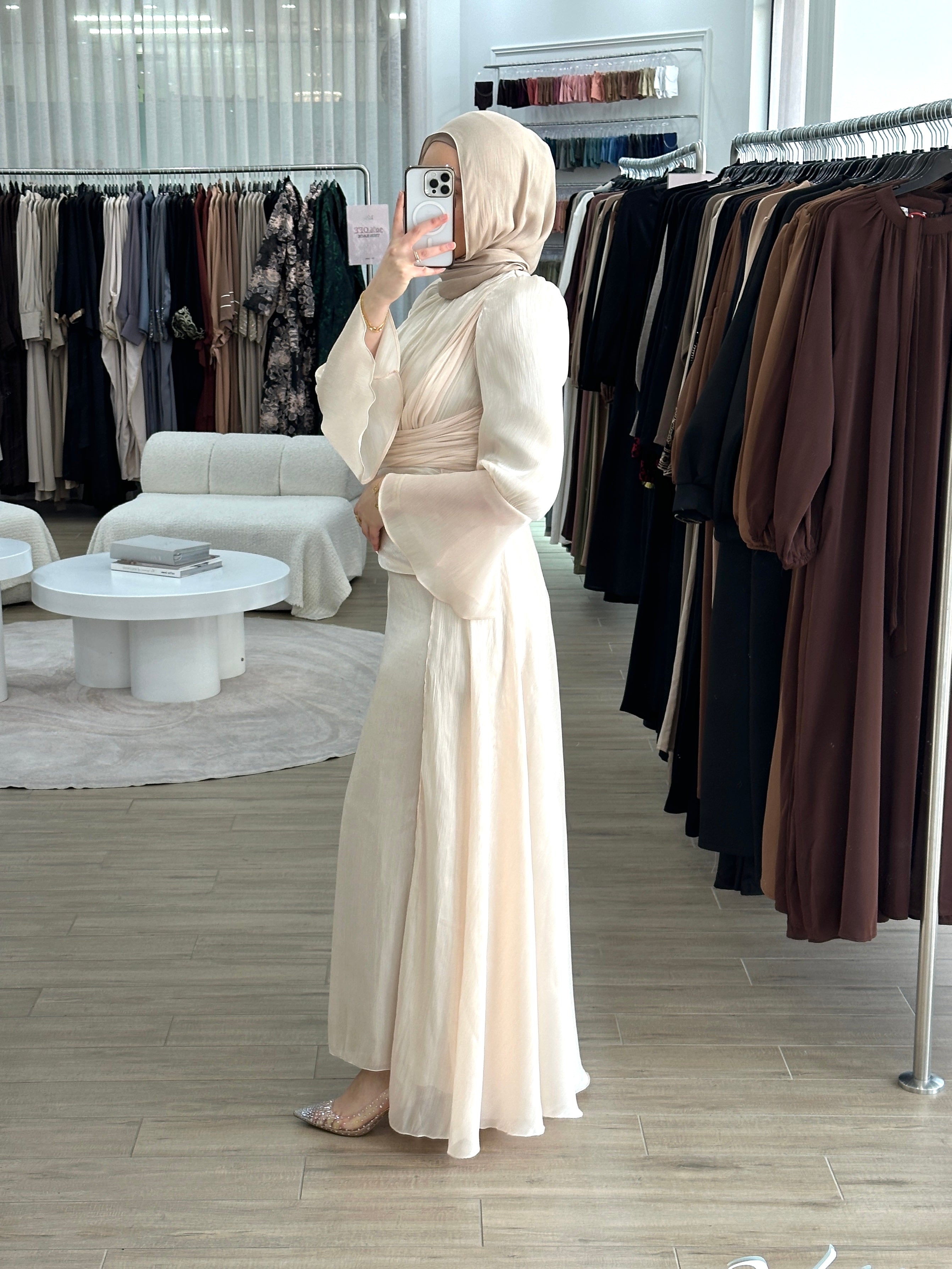 Lamis Formal Dress in shimmery chiffon featuring a ruched bodice with delicate pleat seams and an A-line skirt with flowing drape panels. Designed with long sleeves, fluted cuffs, a ruffled floor-length hem, invisible back zip, and full lining — perfect for elegant formal occasions.