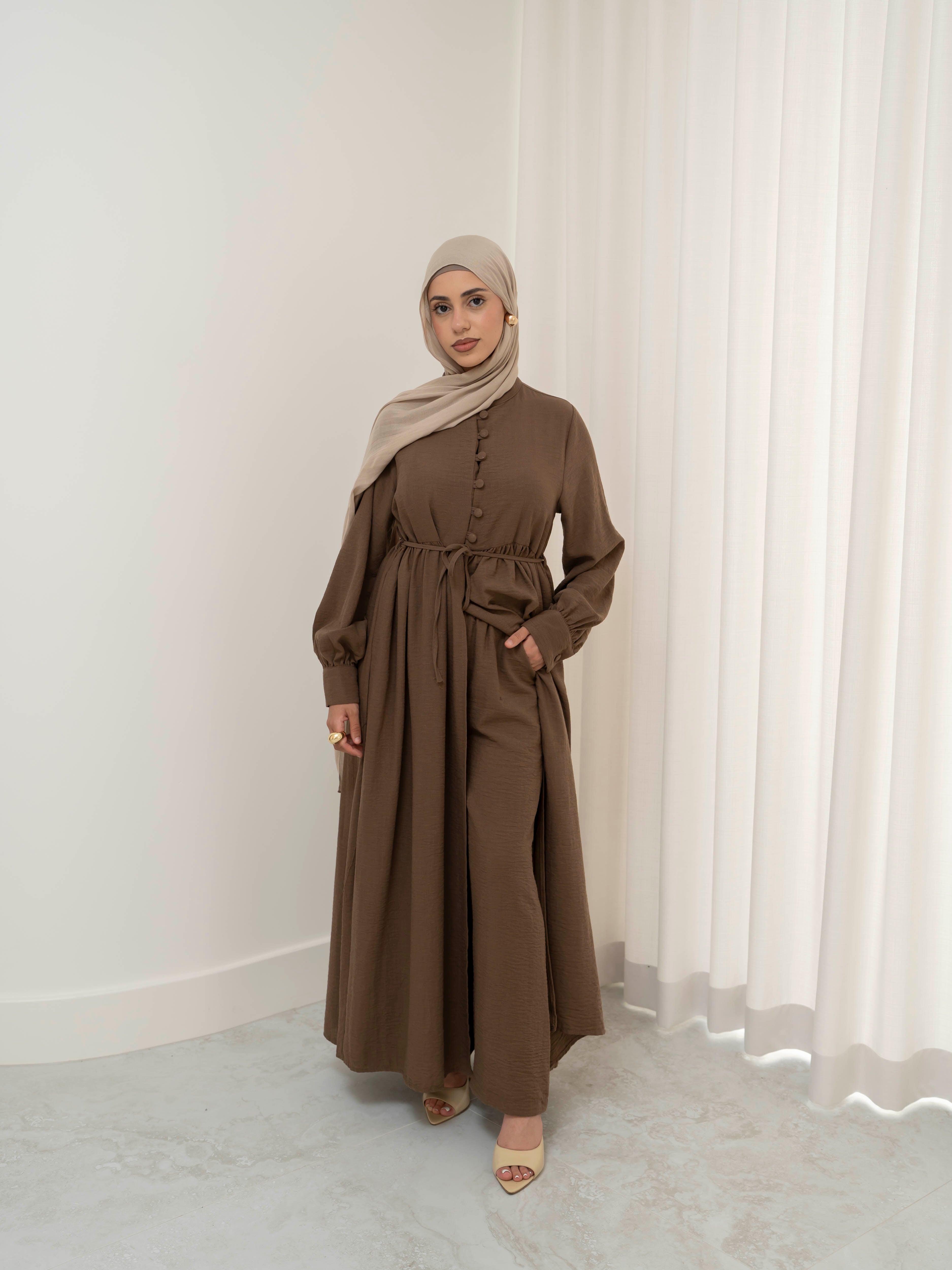 Luna Dress & Pant Set, a two-piece outfit featuring a flowing button-front dress with adjustable waist tie and matching high-waisted pants with elastic waistband and side pockets. Long sleeves with cuffs, lightweight fabric with elegant drape, designed for modest, polished looks suitable for Eid, special occasions, or everyday wear.