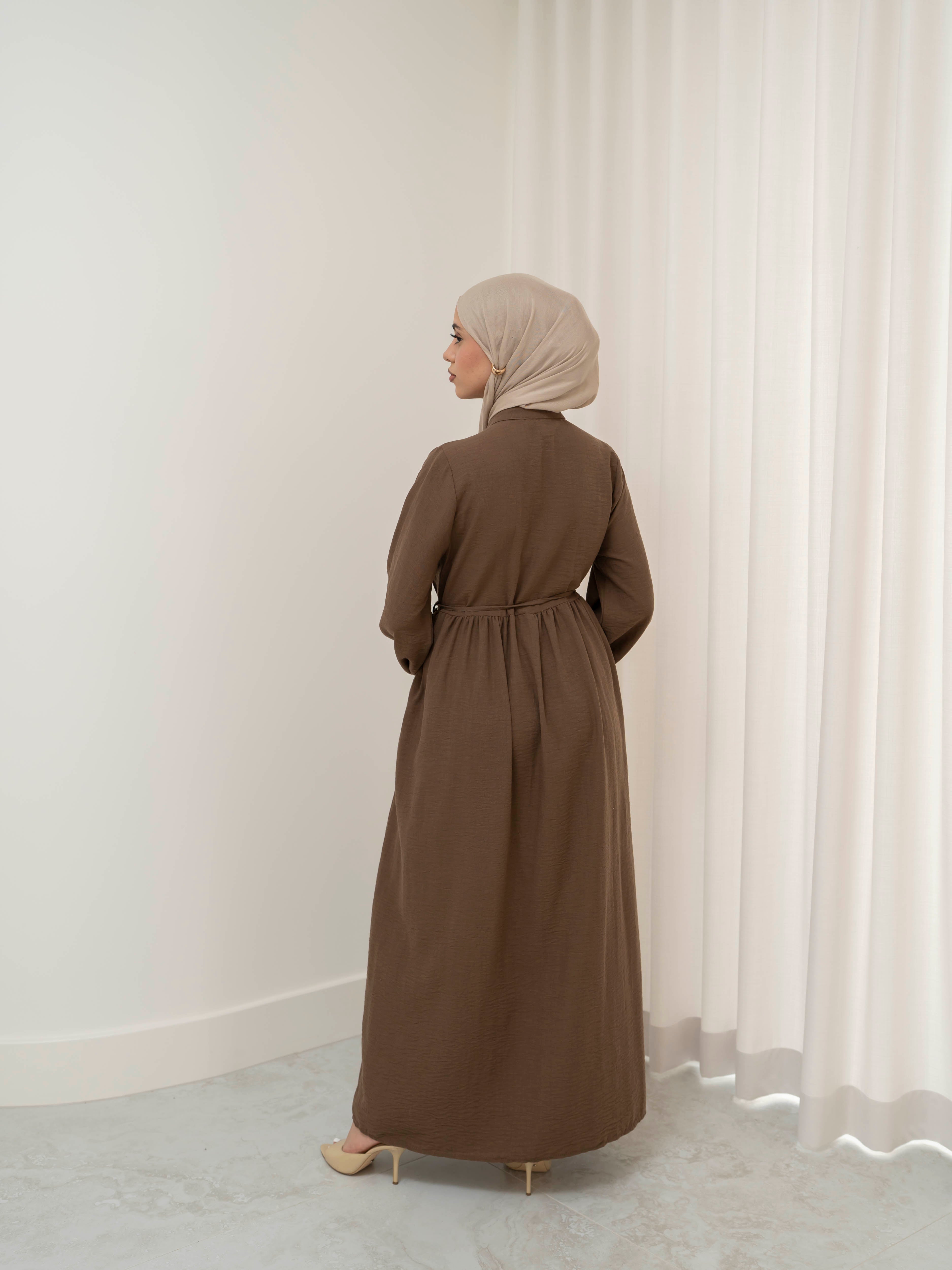 Luna Dress & Pant Set, a two-piece outfit featuring a flowing button-front dress with adjustable waist tie and matching high-waisted pants with elastic waistband and side pockets. Long sleeves with cuffs, lightweight fabric with elegant drape, designed for modest, polished looks suitable for Eid, special occasions, or everyday wear.