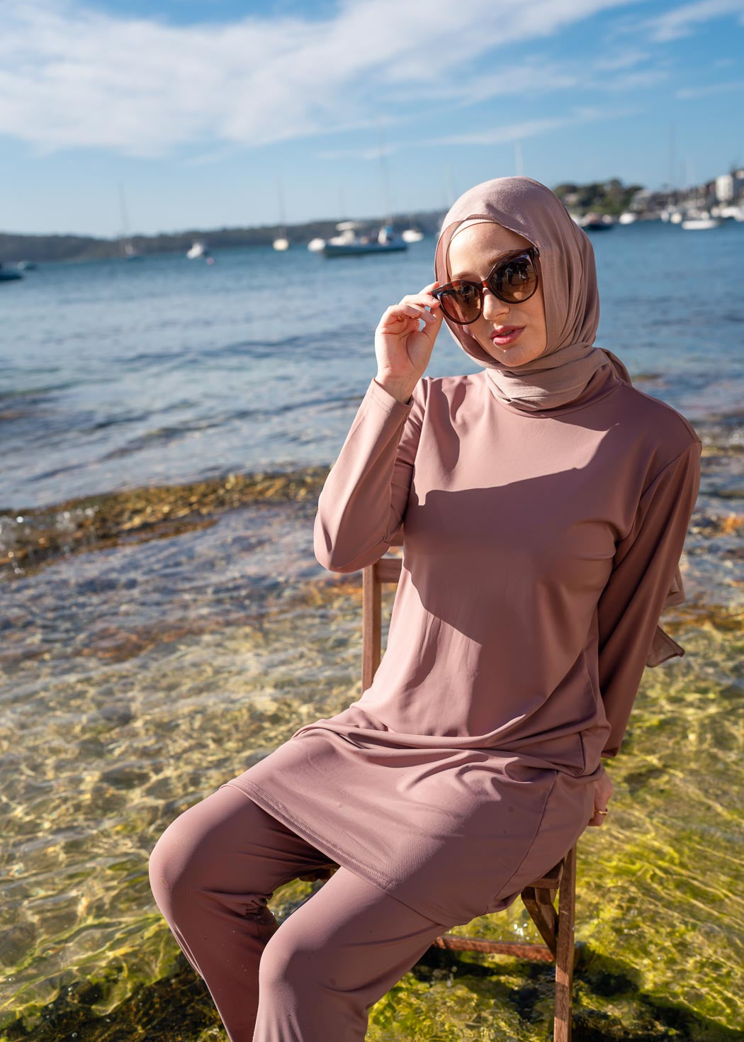 Stay classy and modest this summer in the Marina swimwear set. Available in black and mauve- it's made up of a loose trouser with elasticated waistline and a long sleeve top that reaches above the knee.