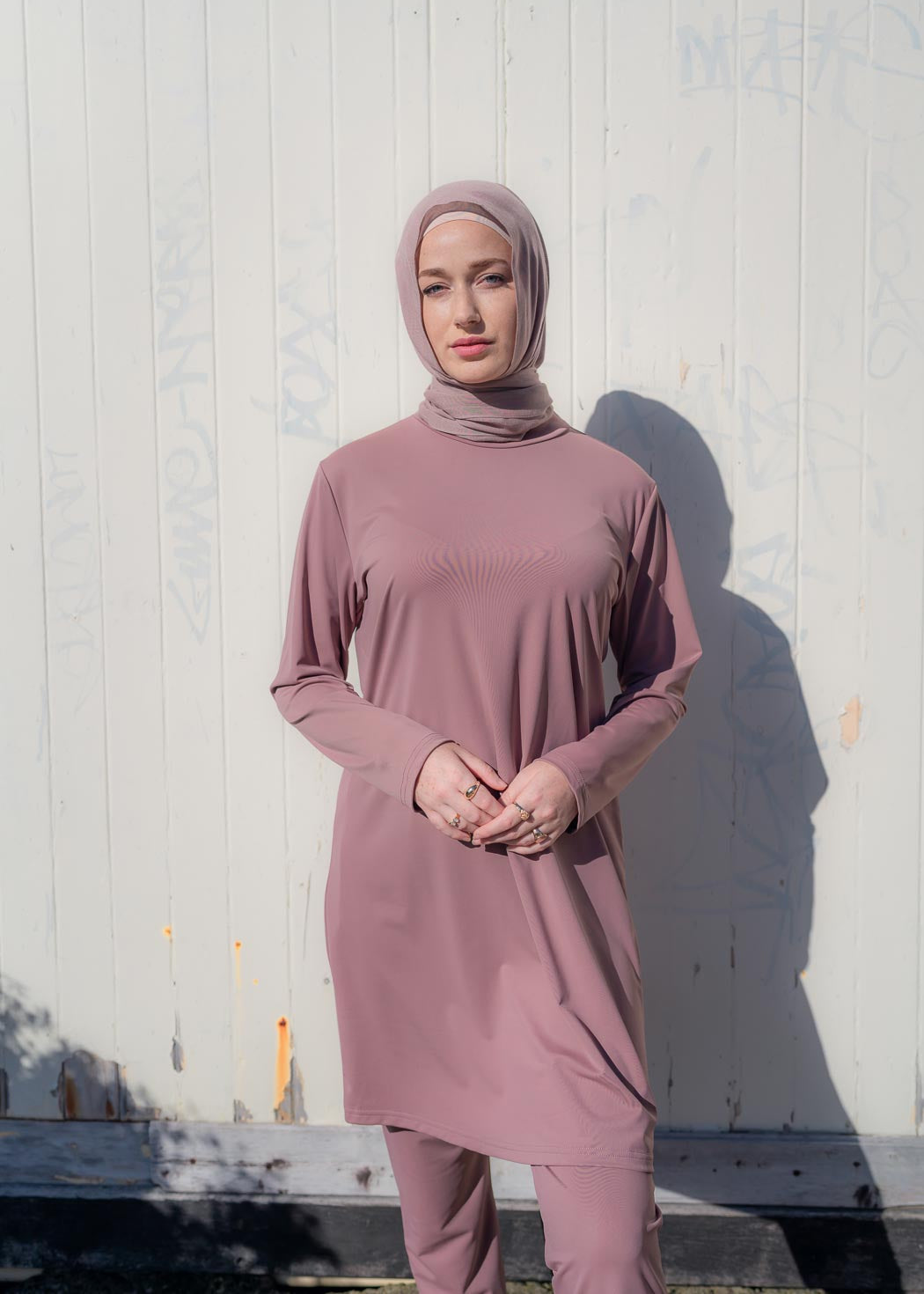 Stay classy and modest this summer in the Marina swimwear set. Available in black and mauve- it's made up of a loose trouser with elasticated waistline and a long sleeve top that reaches above the knee.