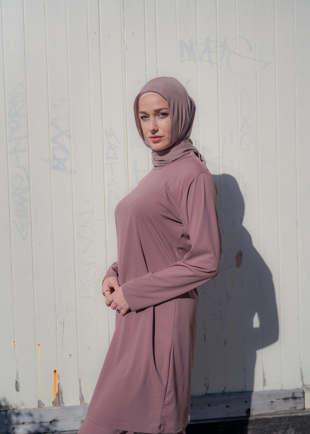 Stay classy and modest this summer in the Marina swimwear set. Available in black and mauve- it's made up of a loose trouser with elasticated waistline and a long sleeve top that reaches above the knee.
