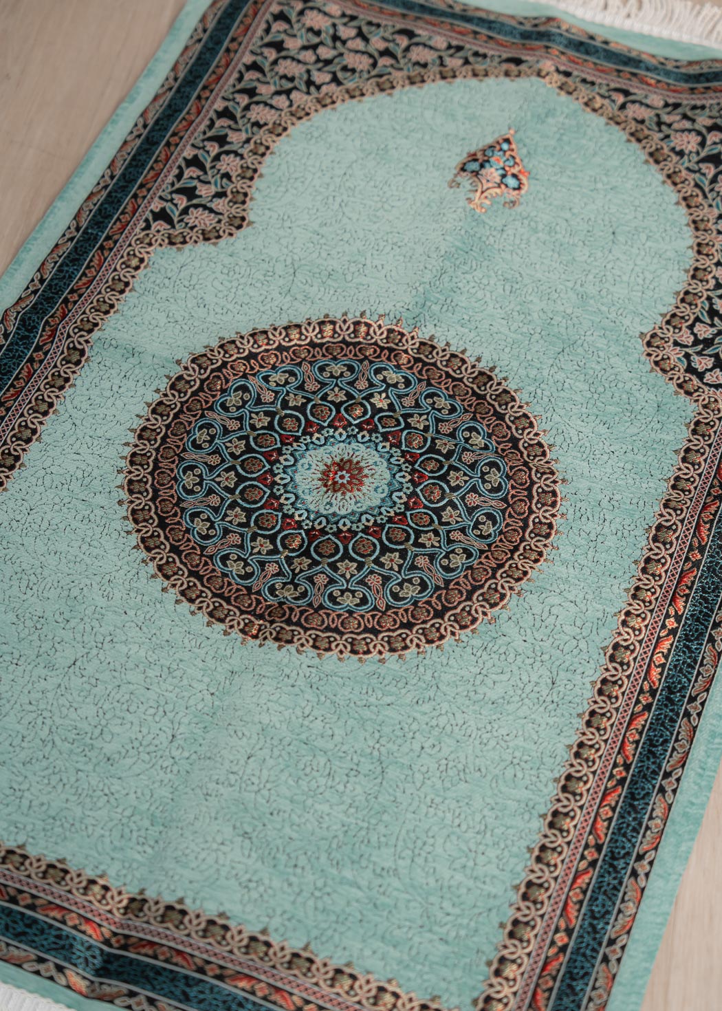 Soft cushioned prayer mat with braided fringe and traditional floral pattern 70cm x 120cm,