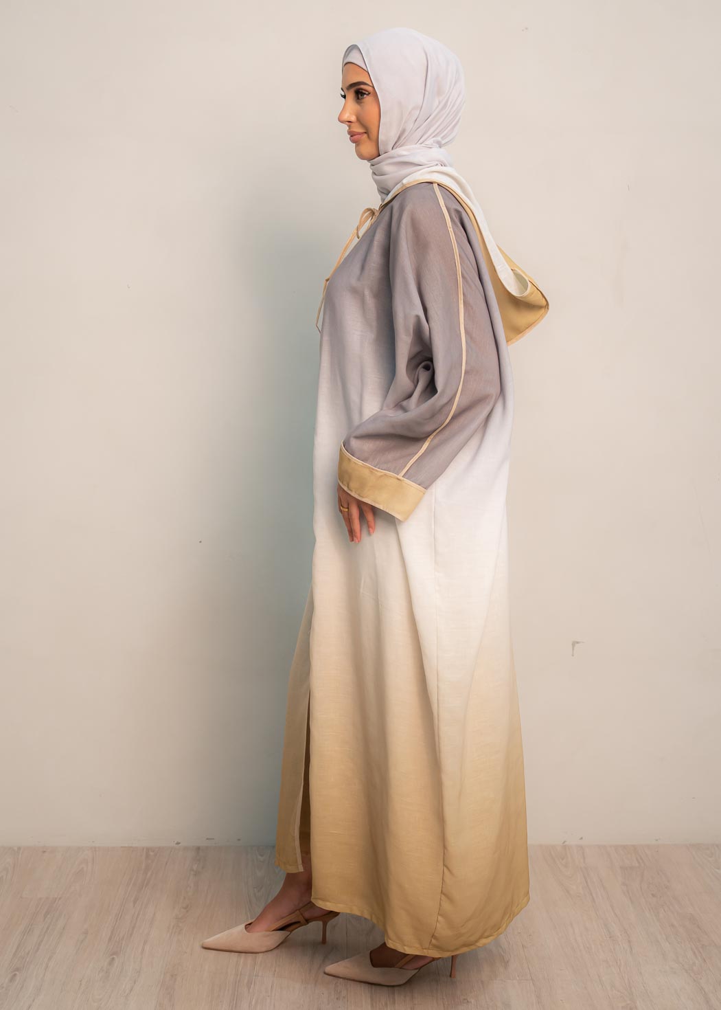 The hooded kaftan dress and tonal dress underlay provide versatility and comfort, while the lace tie neckline adds a feminine touch. Perfect for social occasions and functions, this set will be on high rotation in your wardrobe.