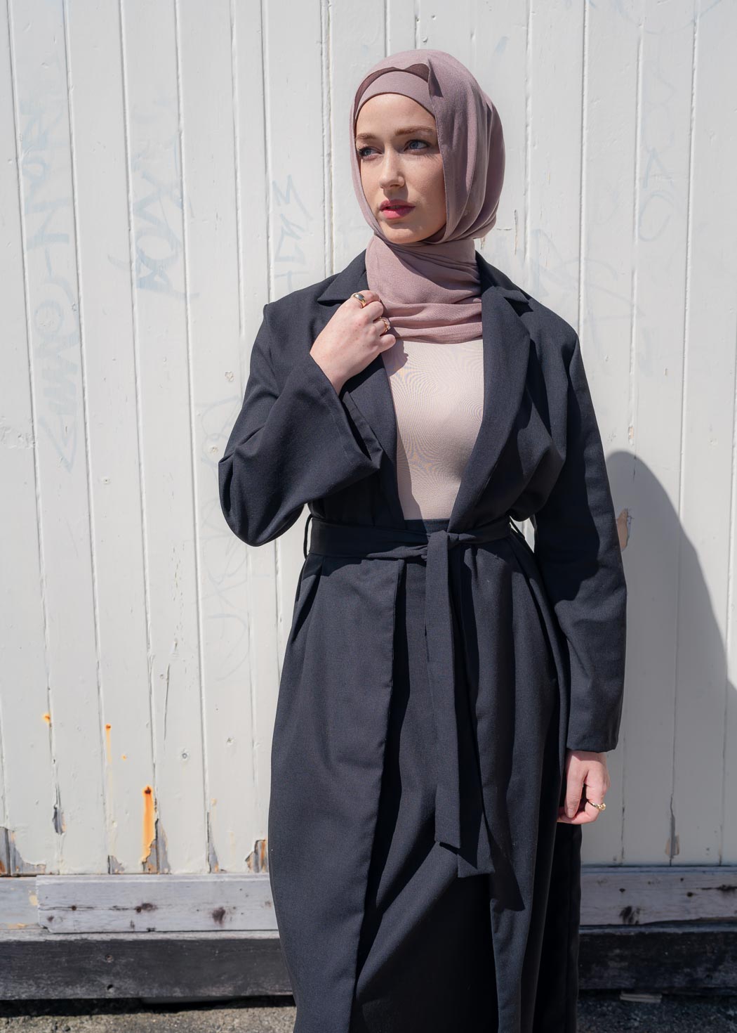 Black two-piece set featuring a maxi-length duster coat and elastic-waist wide-leg skirt, designed in a relaxed, throw-on style for comfortable, effortless wear across seasons.