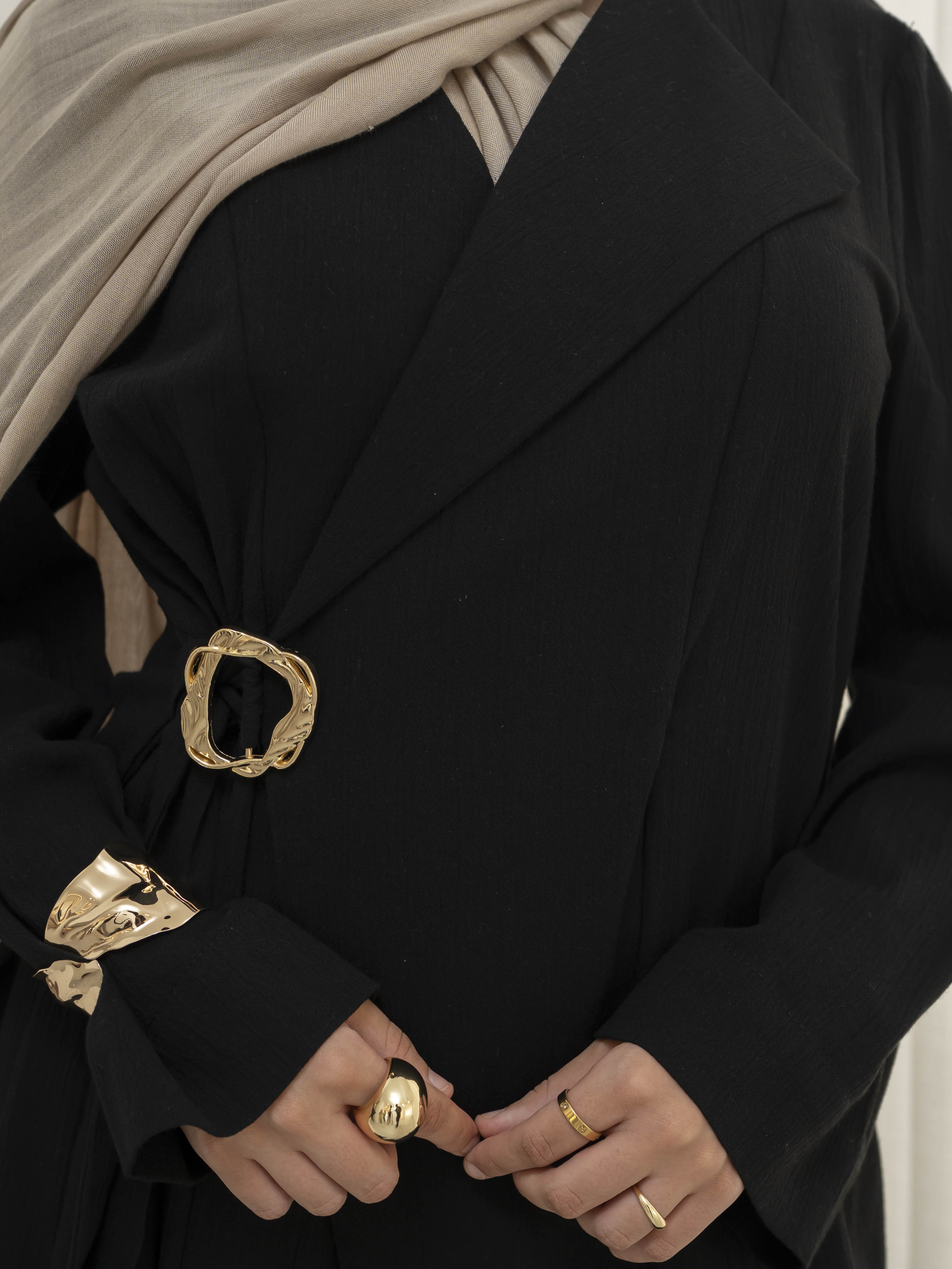 Raya Tailored Set, a two-piece outfit with a belted tailored jacket featuring structured lapels and matching wide-leg pants with elasticated waistband. Full-length, modest silhouette in lightweight fabric with refined drape, ideal for Eid, formal occasions, or elevated everyday wear.