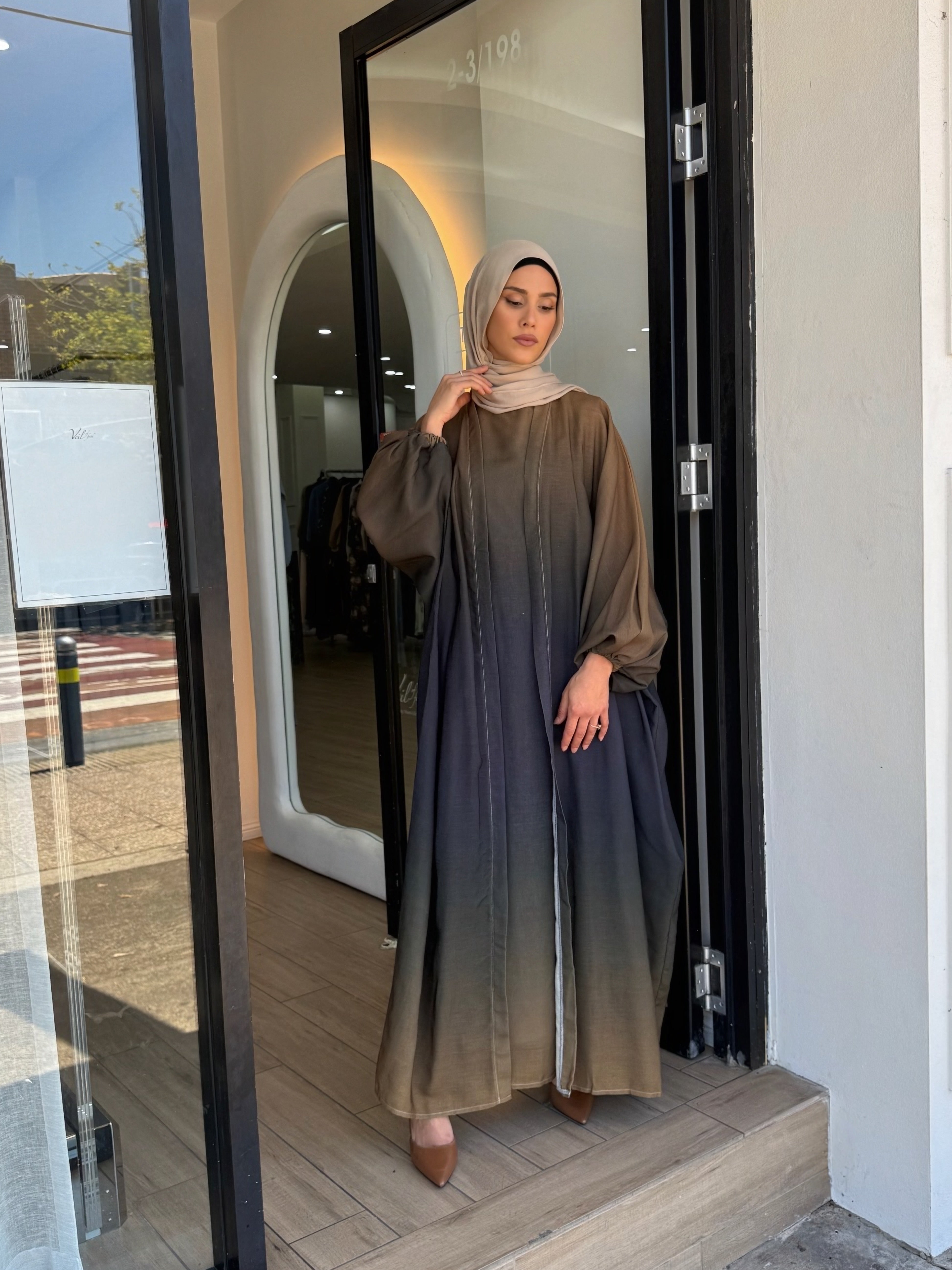 Crafted from a lightweight, airy fabric, it moves beautifully with every step. The loose silhouette ensures comfort without compromising elegance — a serene piece for any occasion.