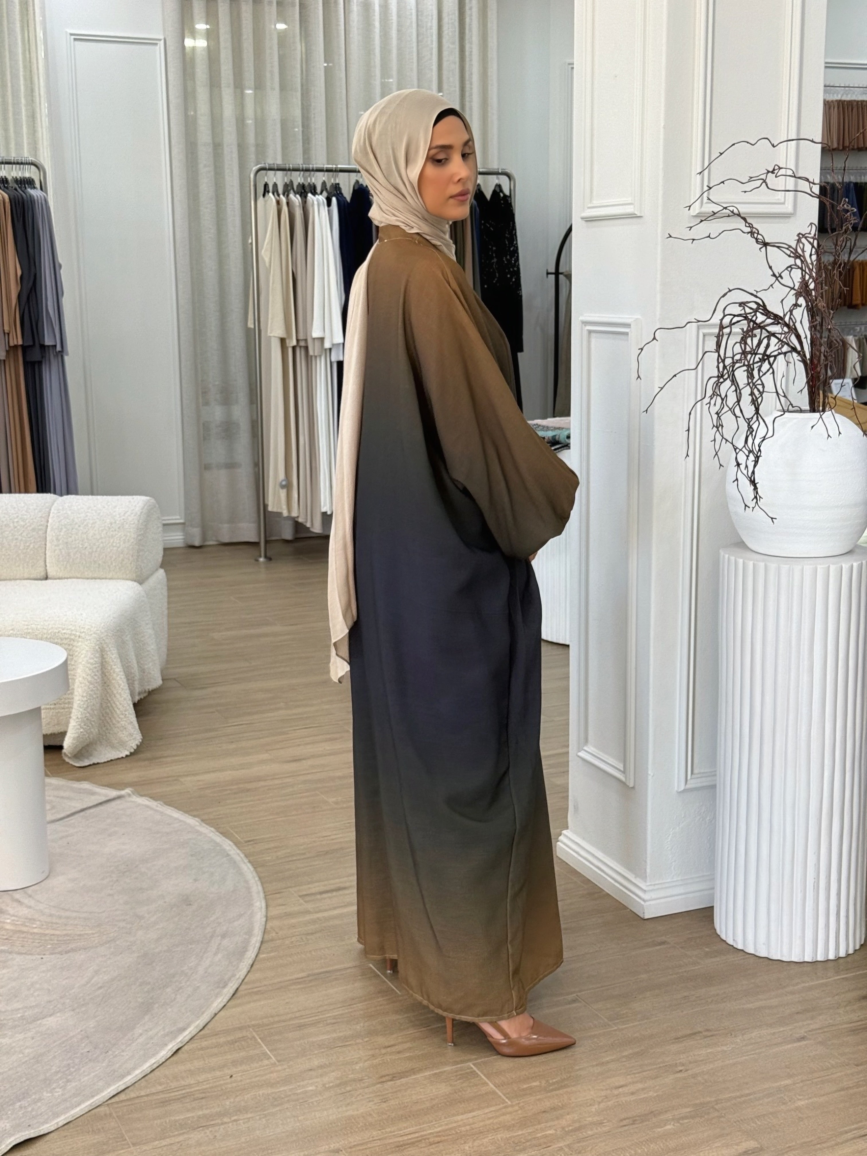 Crafted from a lightweight, airy fabric, it moves beautifully with every step. The loose silhouette ensures comfort without compromising elegance — a serene piece for any occasion.