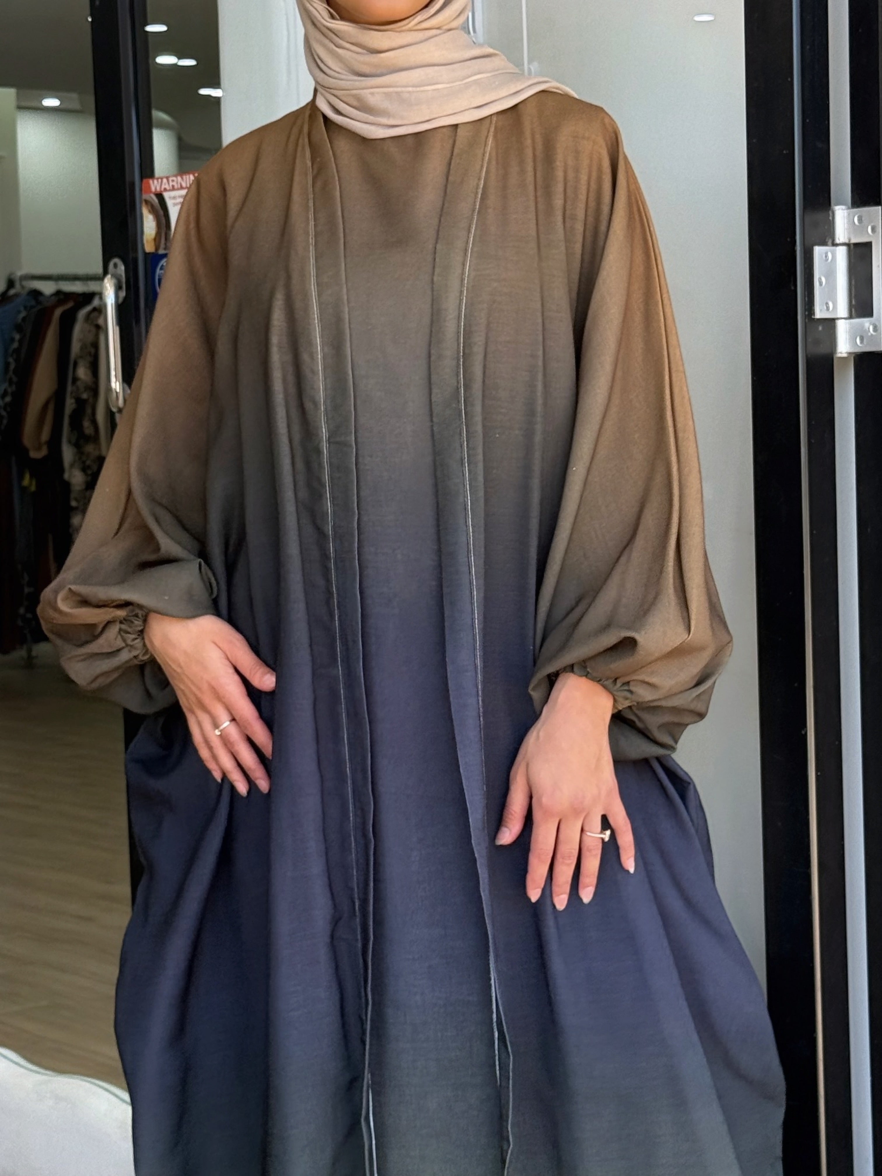 Crafted from a lightweight, airy fabric, it moves beautifully with every step. The loose silhouette ensures comfort without compromising elegance — a serene piece for any occasion.