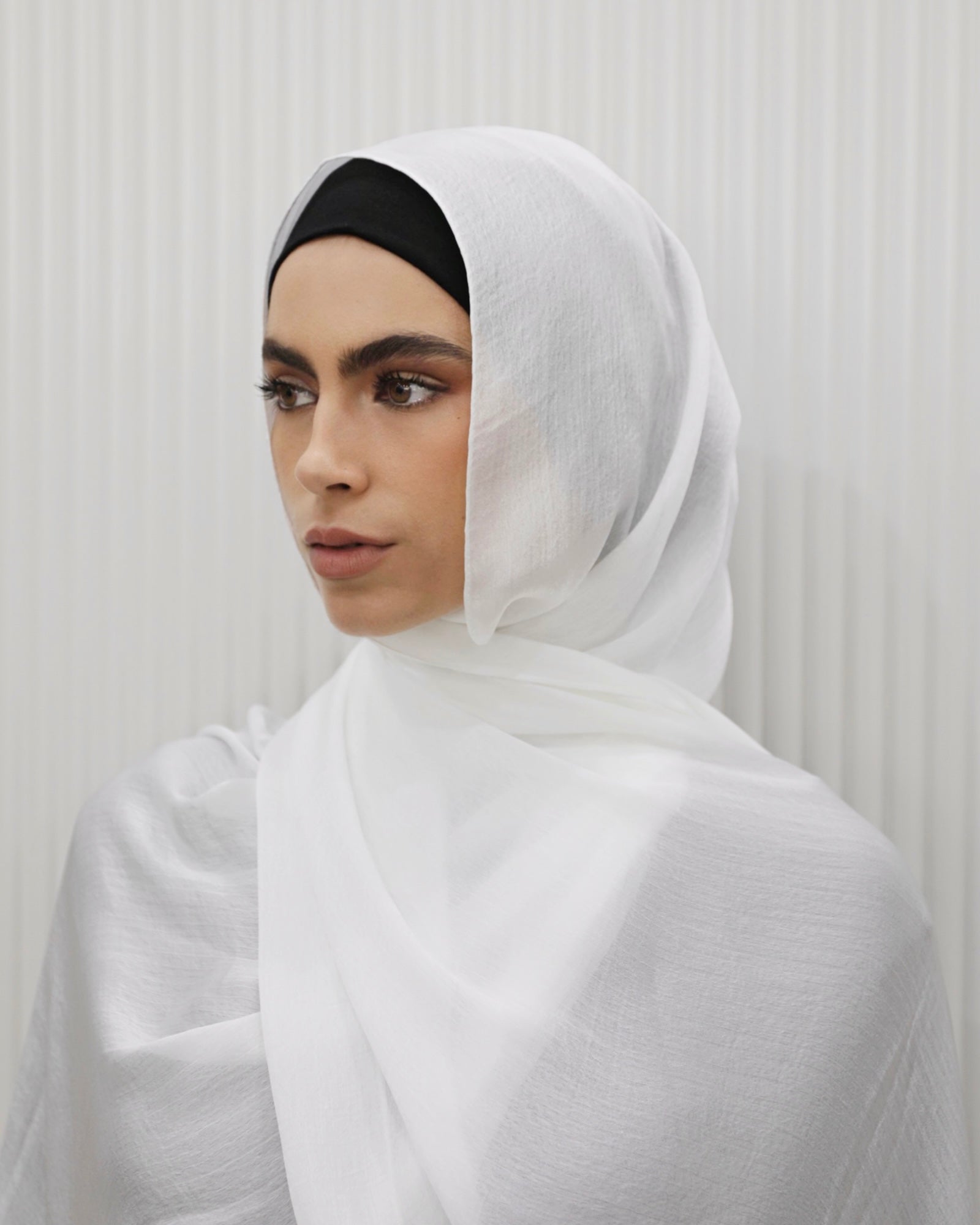 Shimmer Hijab, lightweight with a sparkling, shimmery finish, designed to add a glamorous touch to elevated outfits and formal wear.