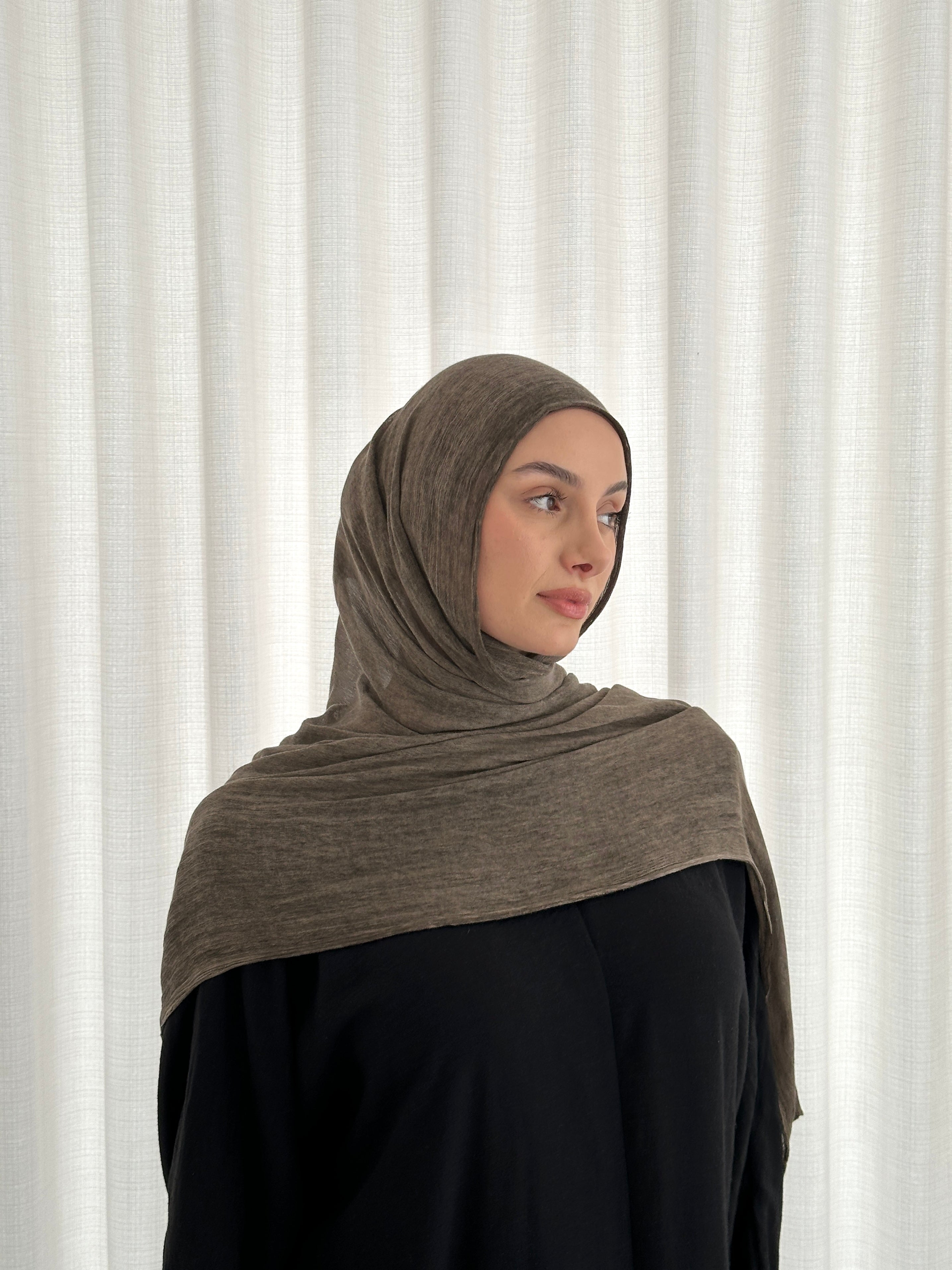 Crafted from soft rayon, this textured hijab drapes effortlessly while offering a breathable and lightweight feel.