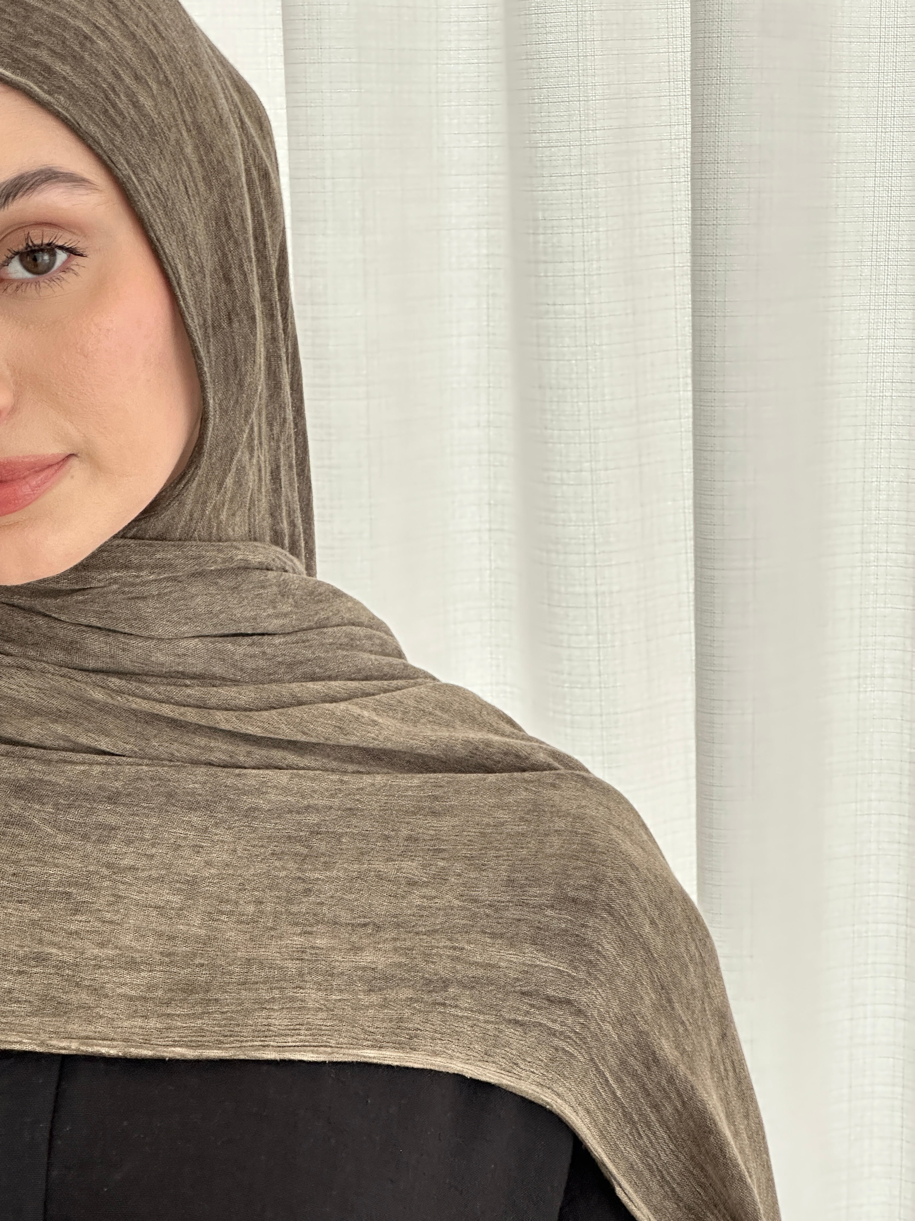 Crafted from soft rayon, this textured hijab drapes effortlessly while offering a breathable and lightweight feel.
