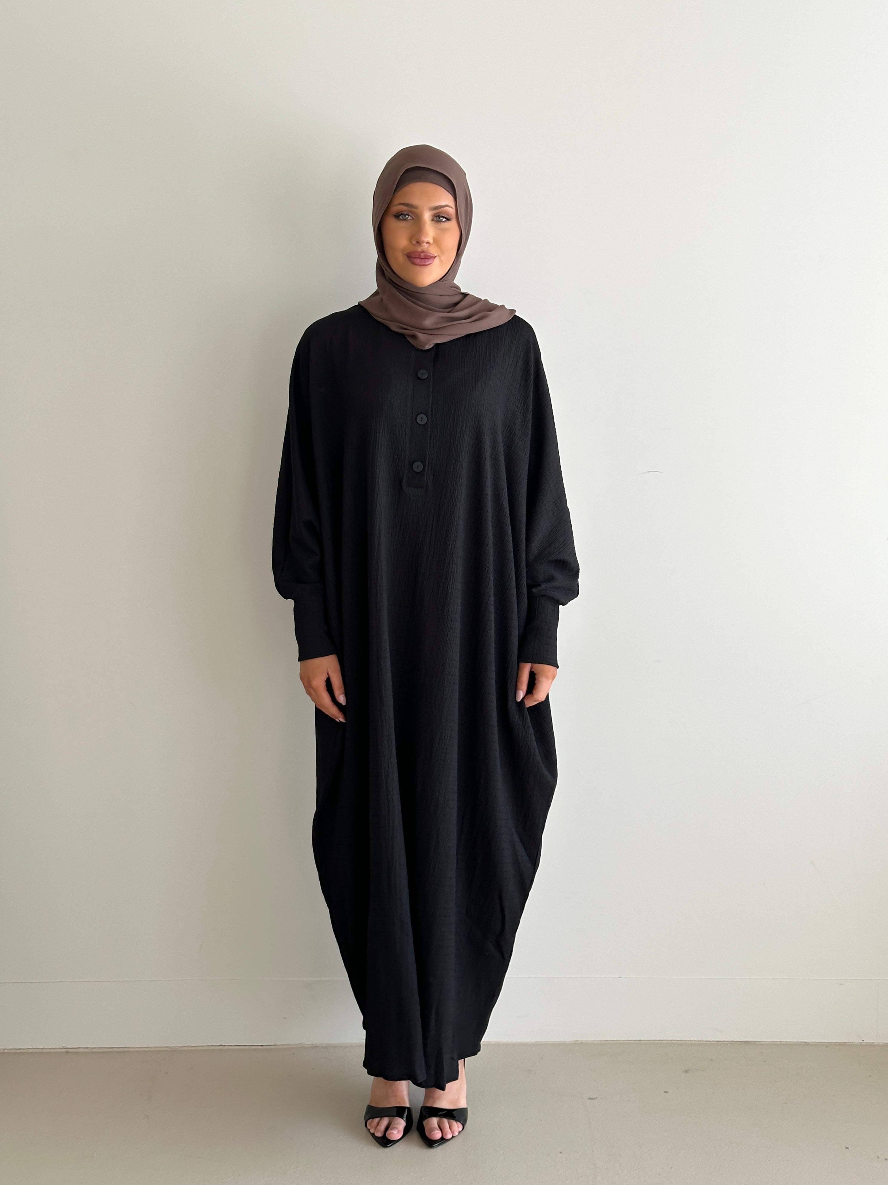 women's oversize abaya, maxi dress with long sleeves and full length, lightweight with buttons and modest for all seasons.