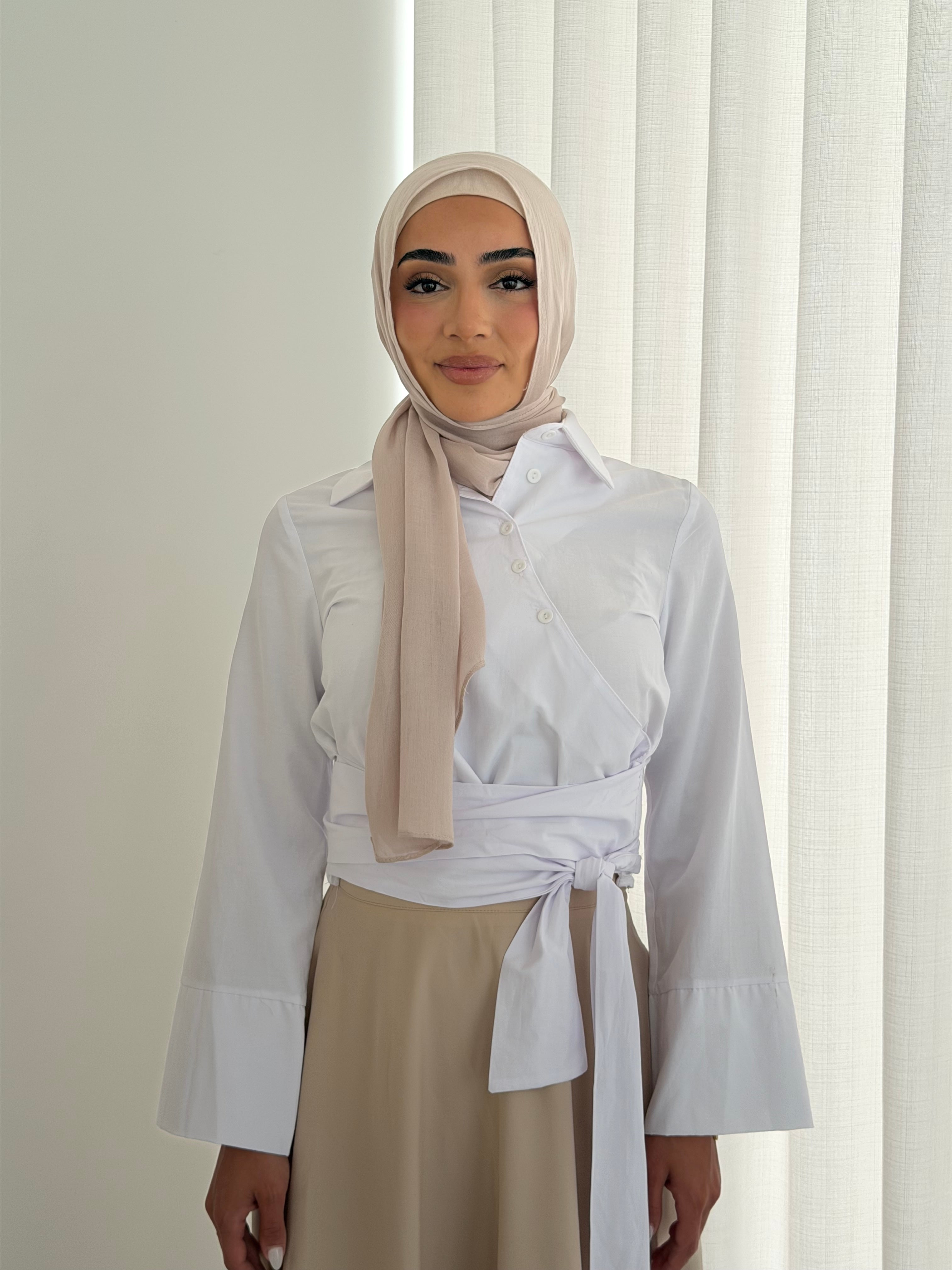 women's button wrap shirt with tie, collar and long sleeves in baby blue and white. top for hijabi friendly, modest fashion.