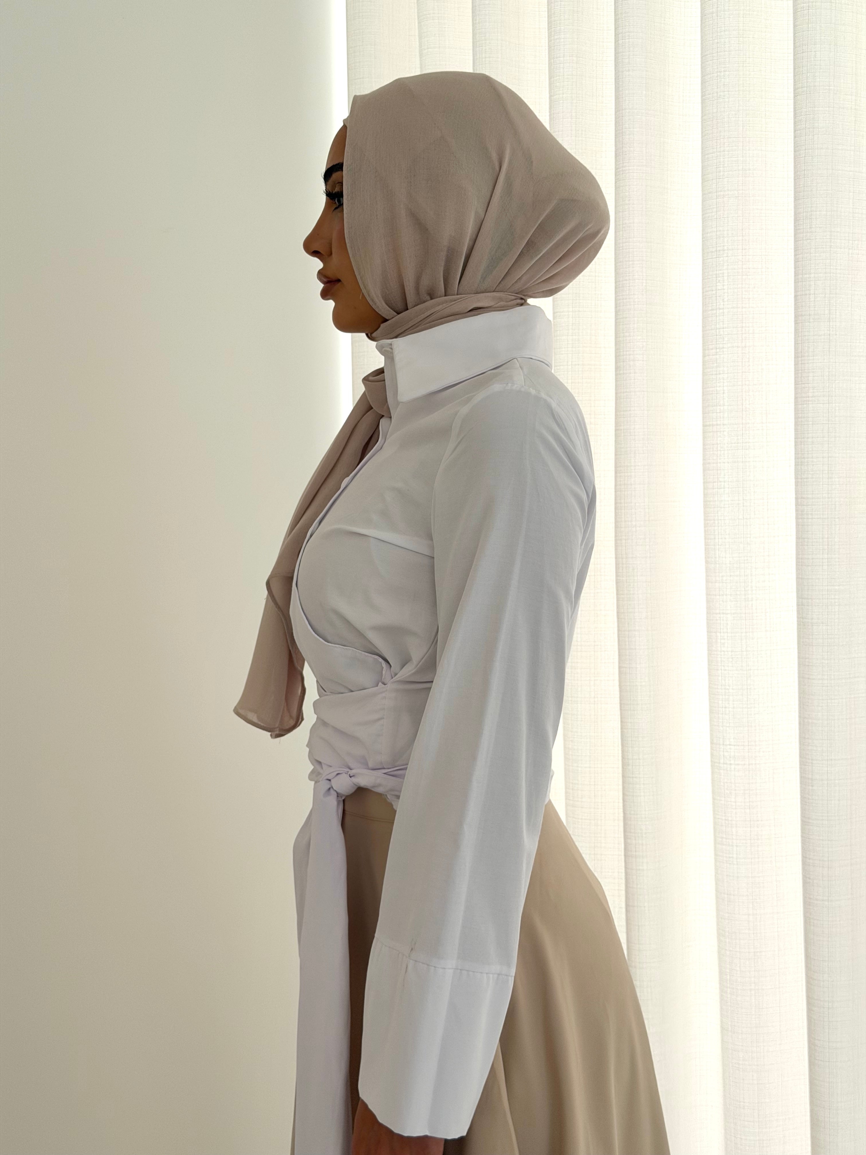 women's button wrap shirt with tie, collar and long sleeves in baby blue and white. top for hijabi friendly, modest fashion.