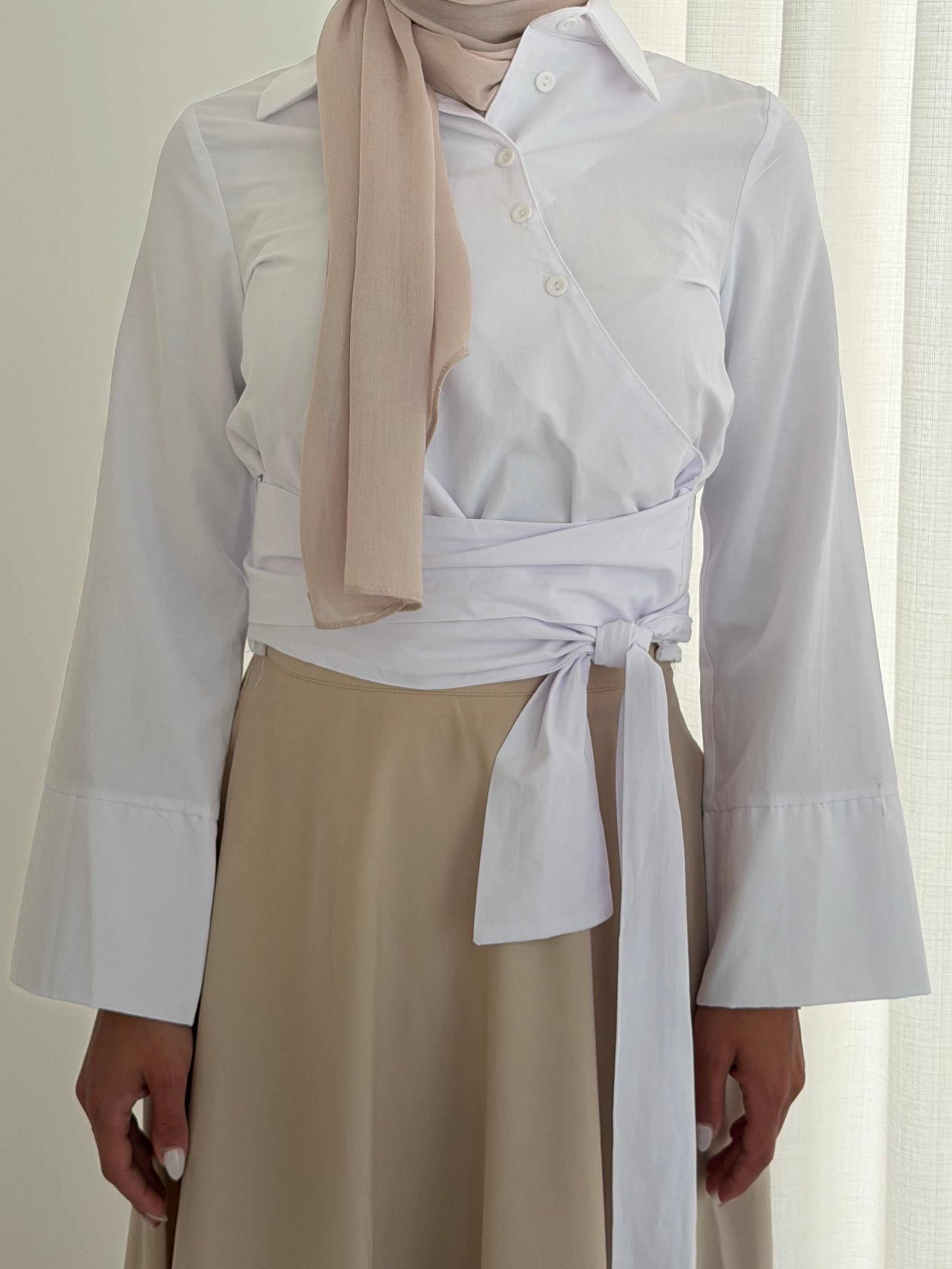 women's button wrap shirt with tie, collar and long sleeves in baby blue and white. top for hijabi friendly, modest fashion.
