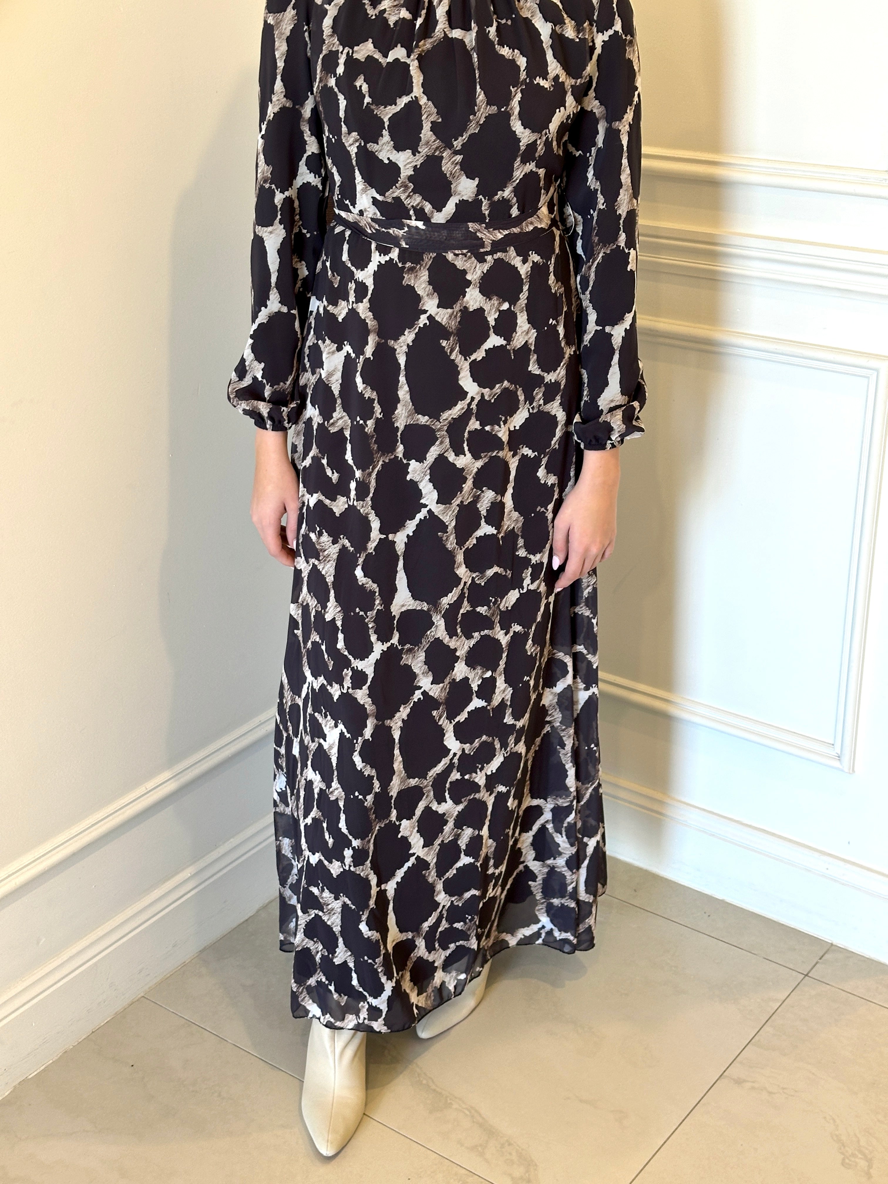 woman wearing printed chiffon maxi dress