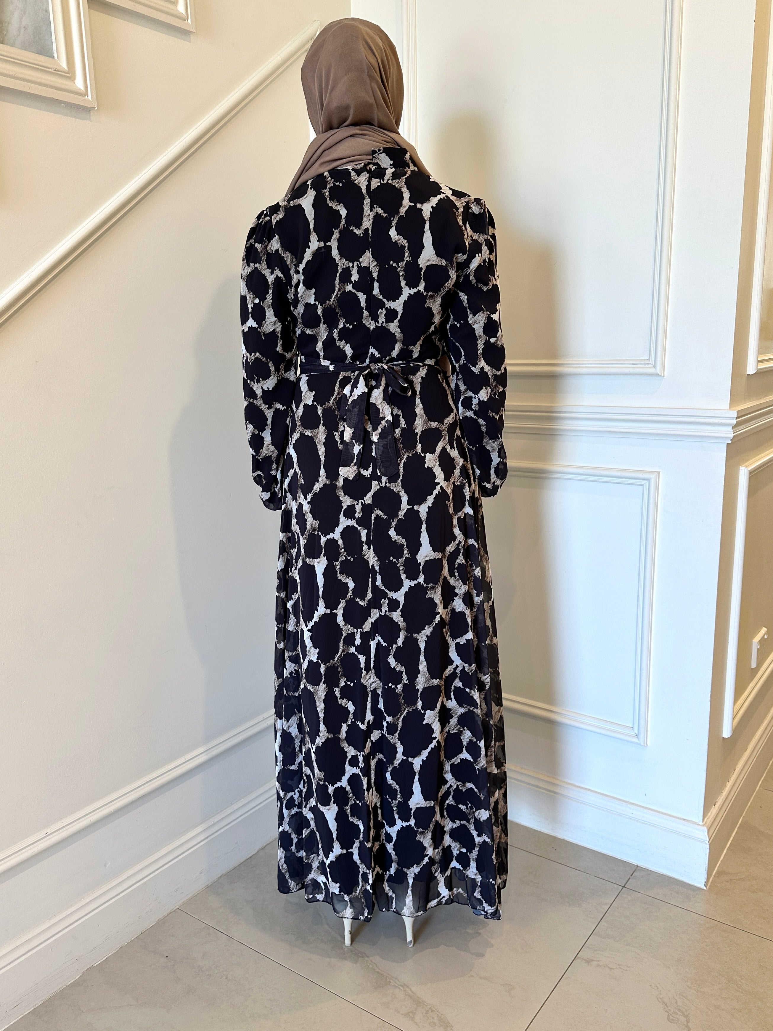 woman wearing printed chiffon maxi dress