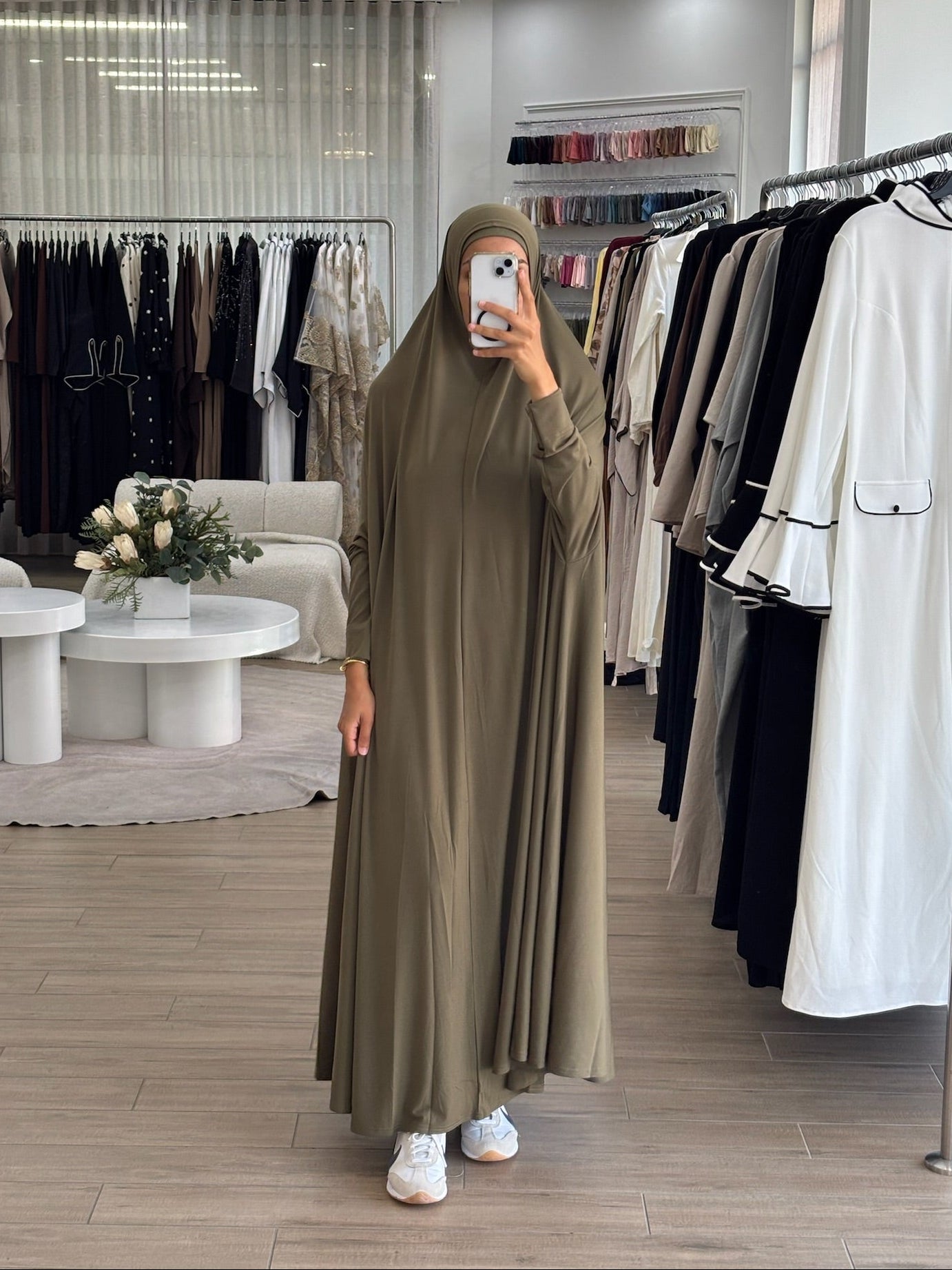 Model wearing a floor-length jilbab with a loose, flowing silhouette, styled for comfortable and modest everyday wear.