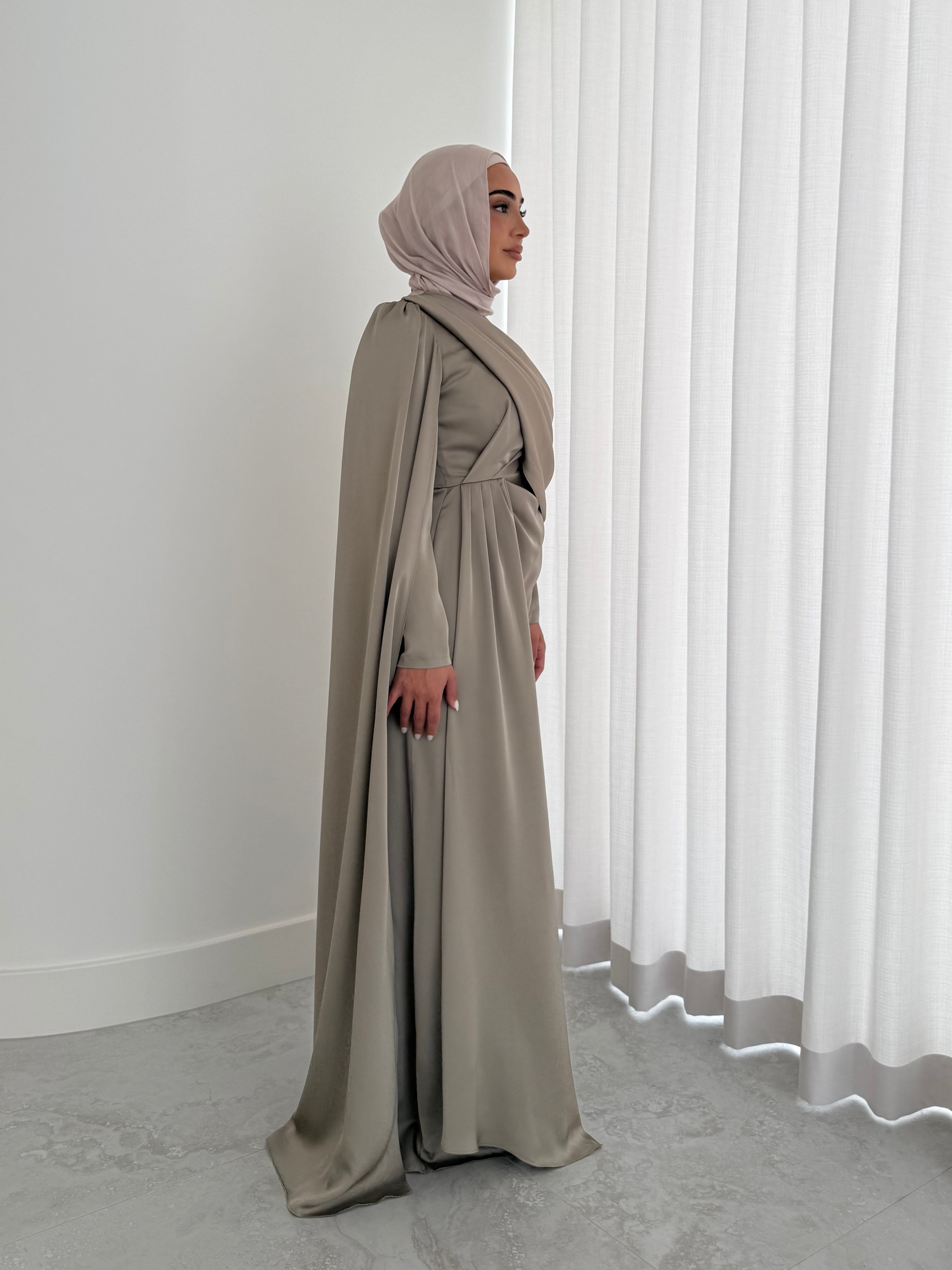 women's full length formal dress in satin, maxi with long sleeves. soft satin drape in lightweight fabrication for spring summer day or night event. hijabi friendly, modest and full coverage for prom, formals, engagements, kk, nikkah, fatiha, wedding guest.