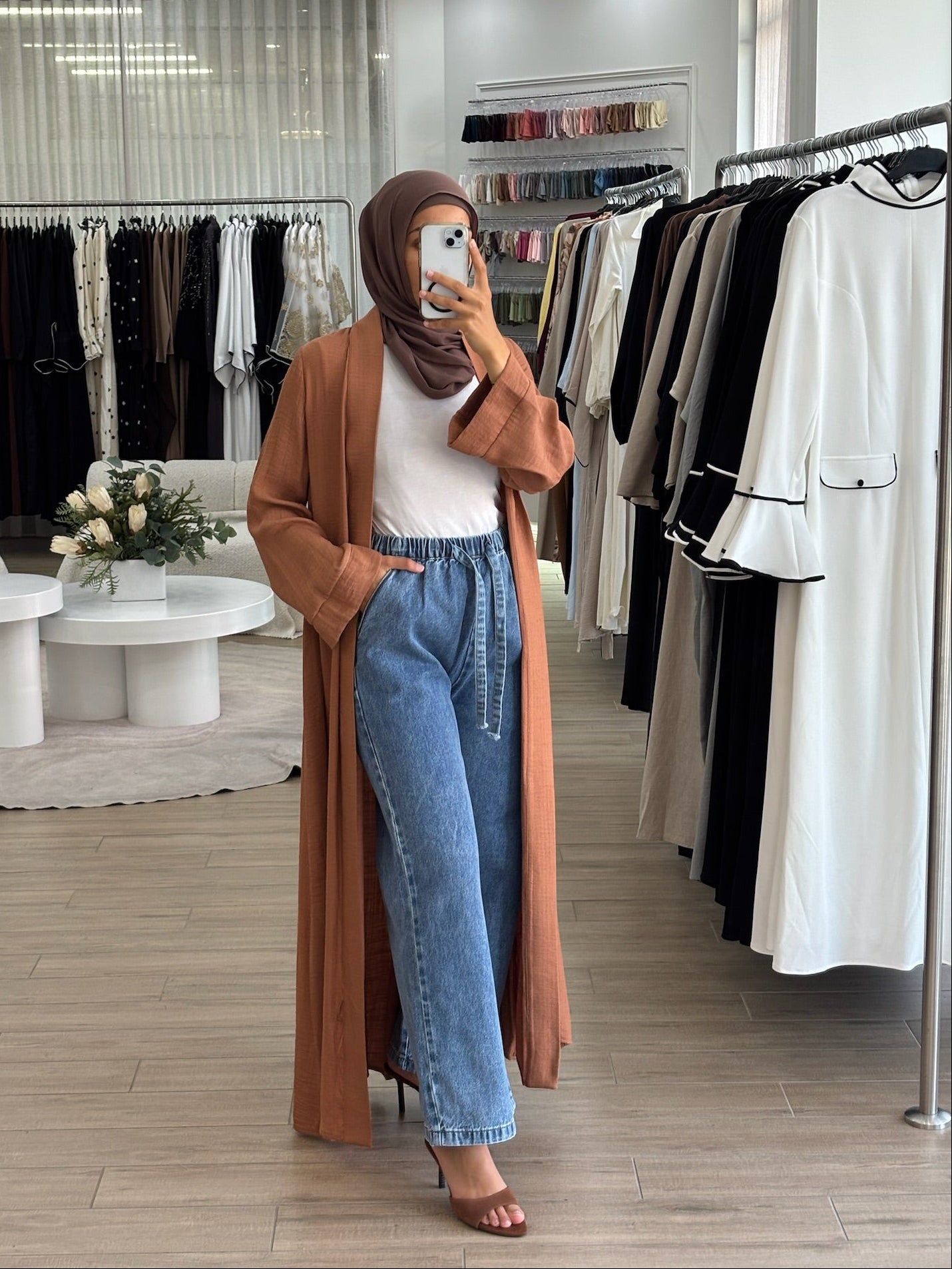 Long orange open kimono styled over a modest outfit, designed for effortless everyday layering.