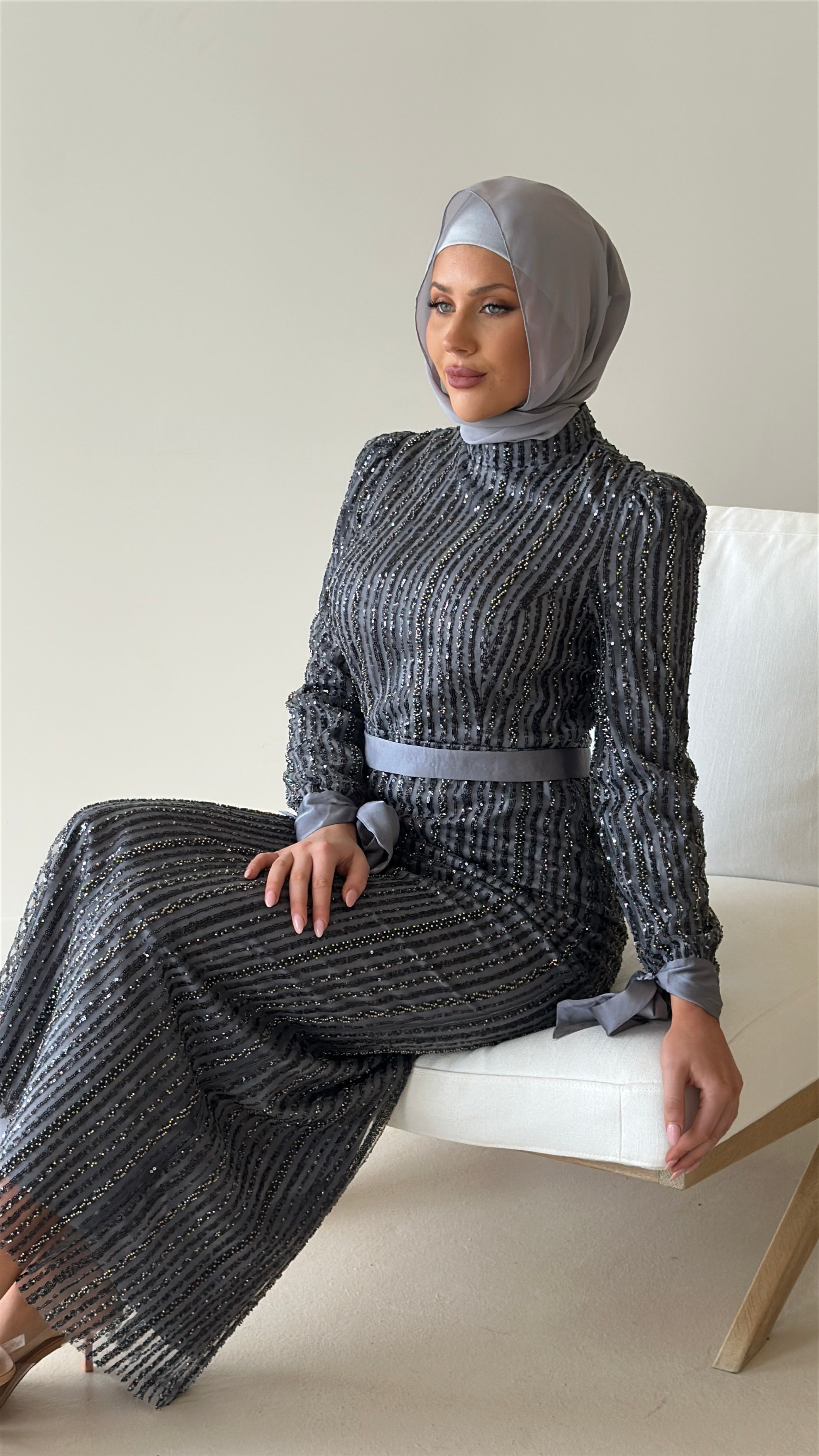 women wearing modest embellished formal dress, maxi, long sleeve with hijab in grey