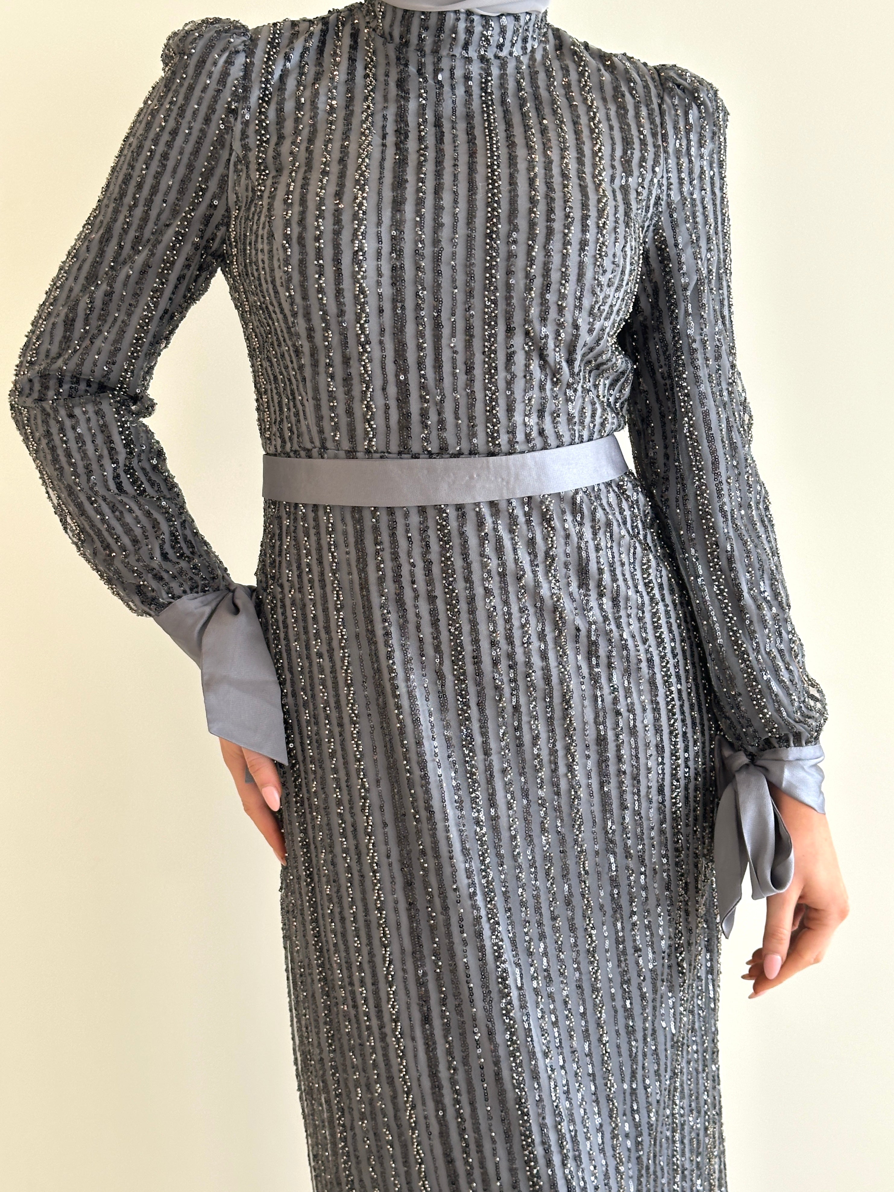 women wearing modest embellished formal dress, maxi, long sleeve with hijab in grey