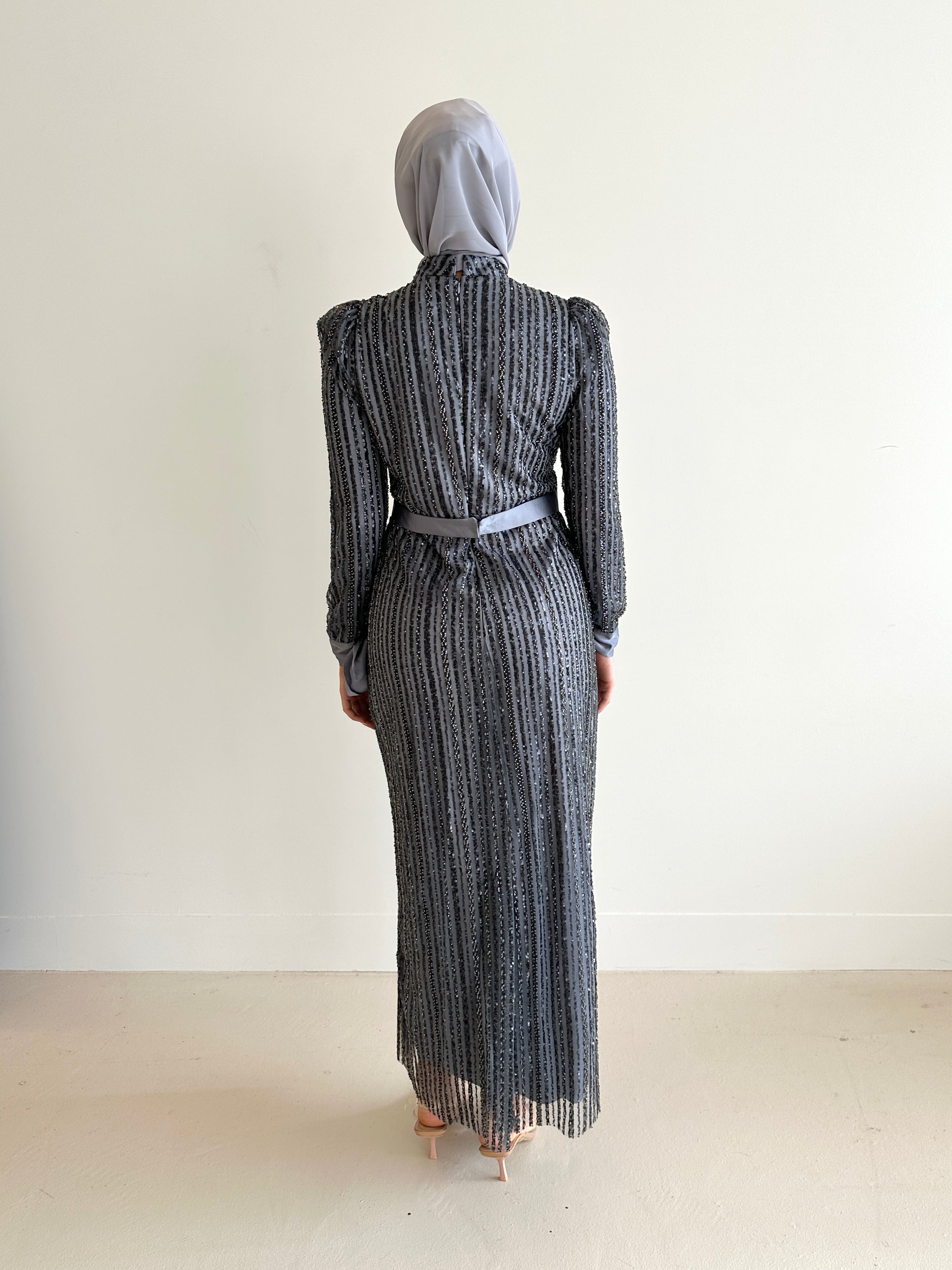 women wearing modest embellished formal dress, maxi, long sleeve with hijab in grey