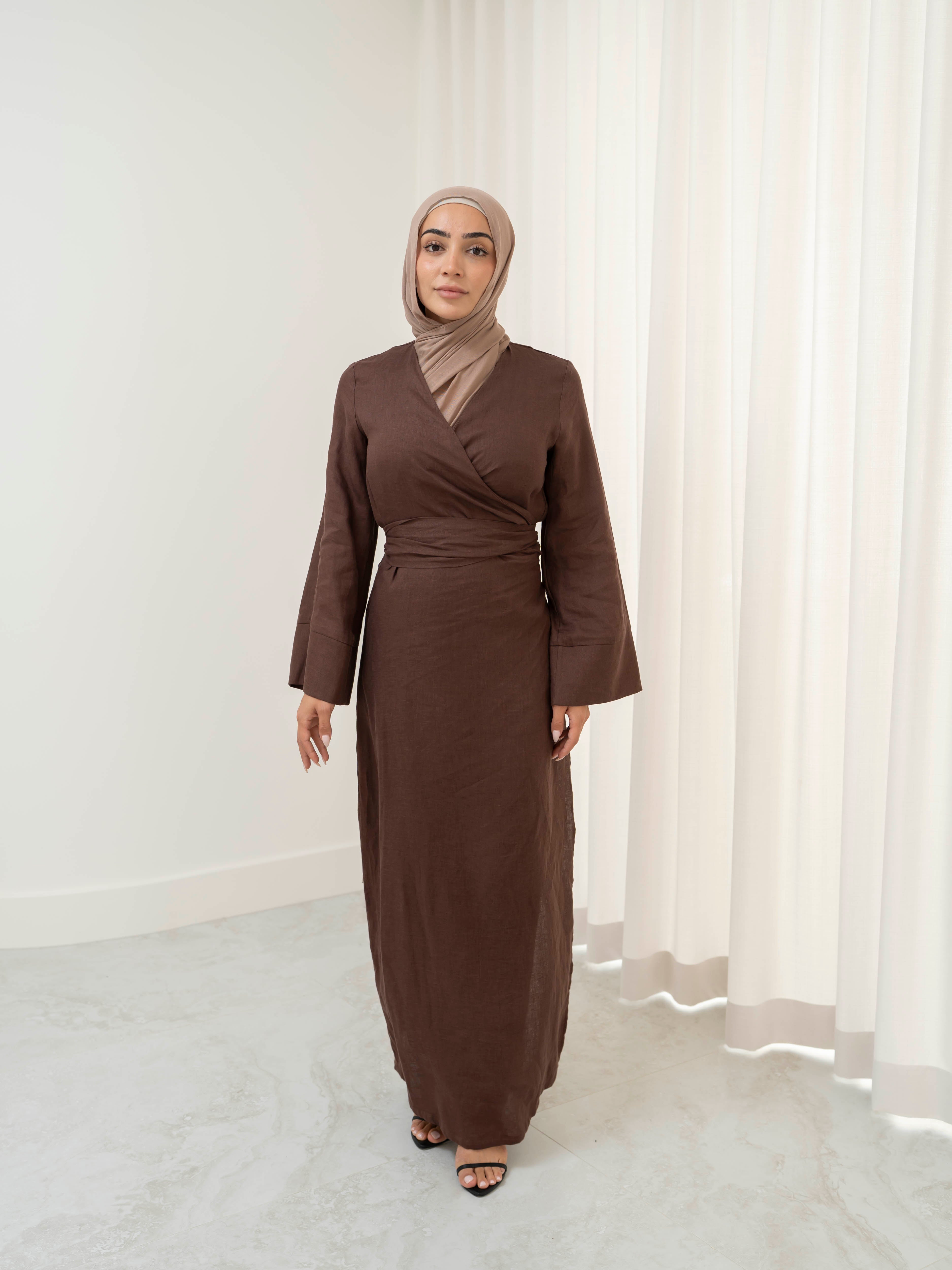 Model wearing the Linen Kimono Wrap featuring a relaxed silhouette in breathable linen fabric, styled as a wrap for a modest and effortless look.