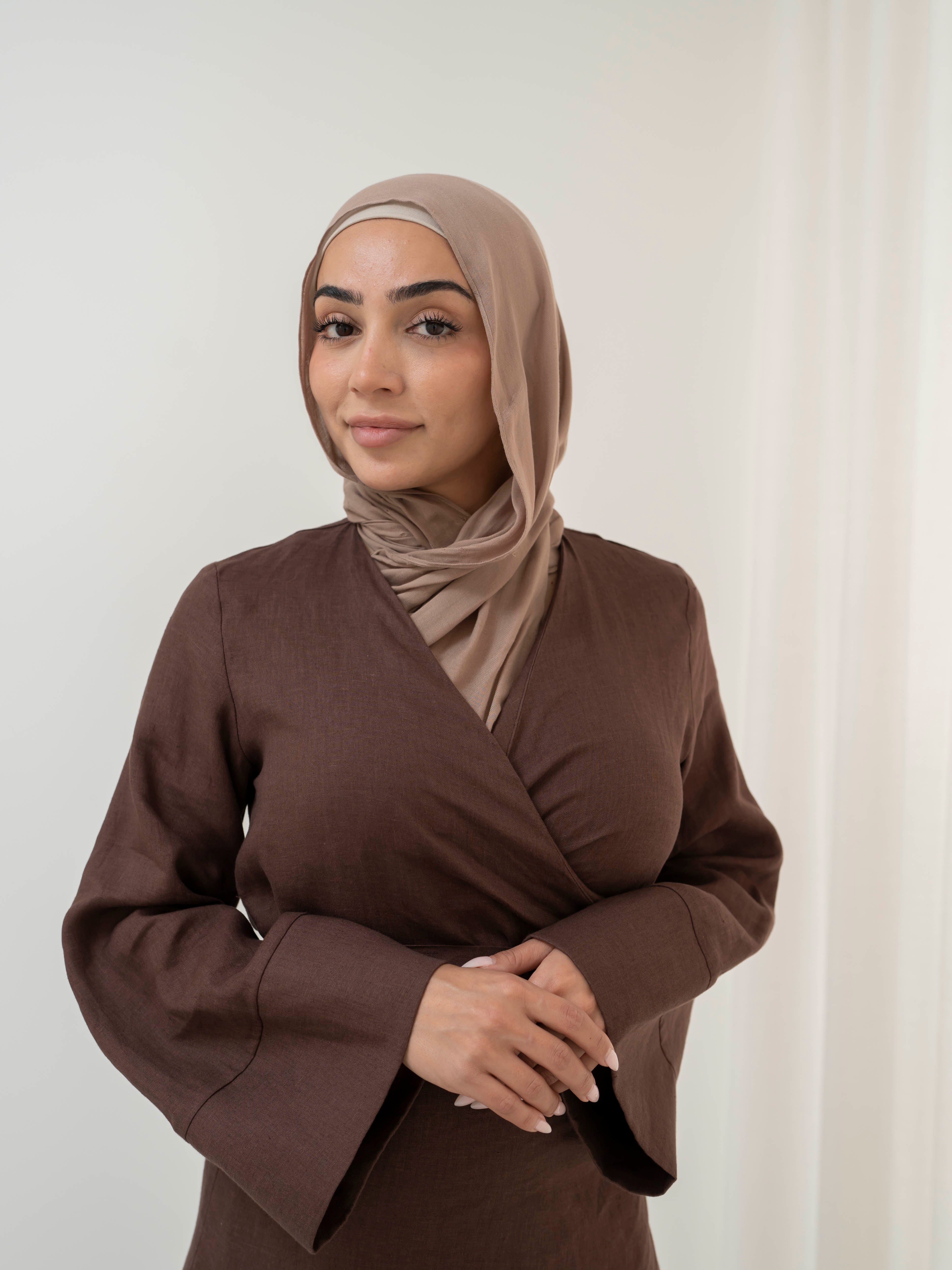 Model wearing the Linen Kimono Wrap featuring a relaxed silhouette in breathable linen fabric, styled as a wrap for a modest and effortless look.