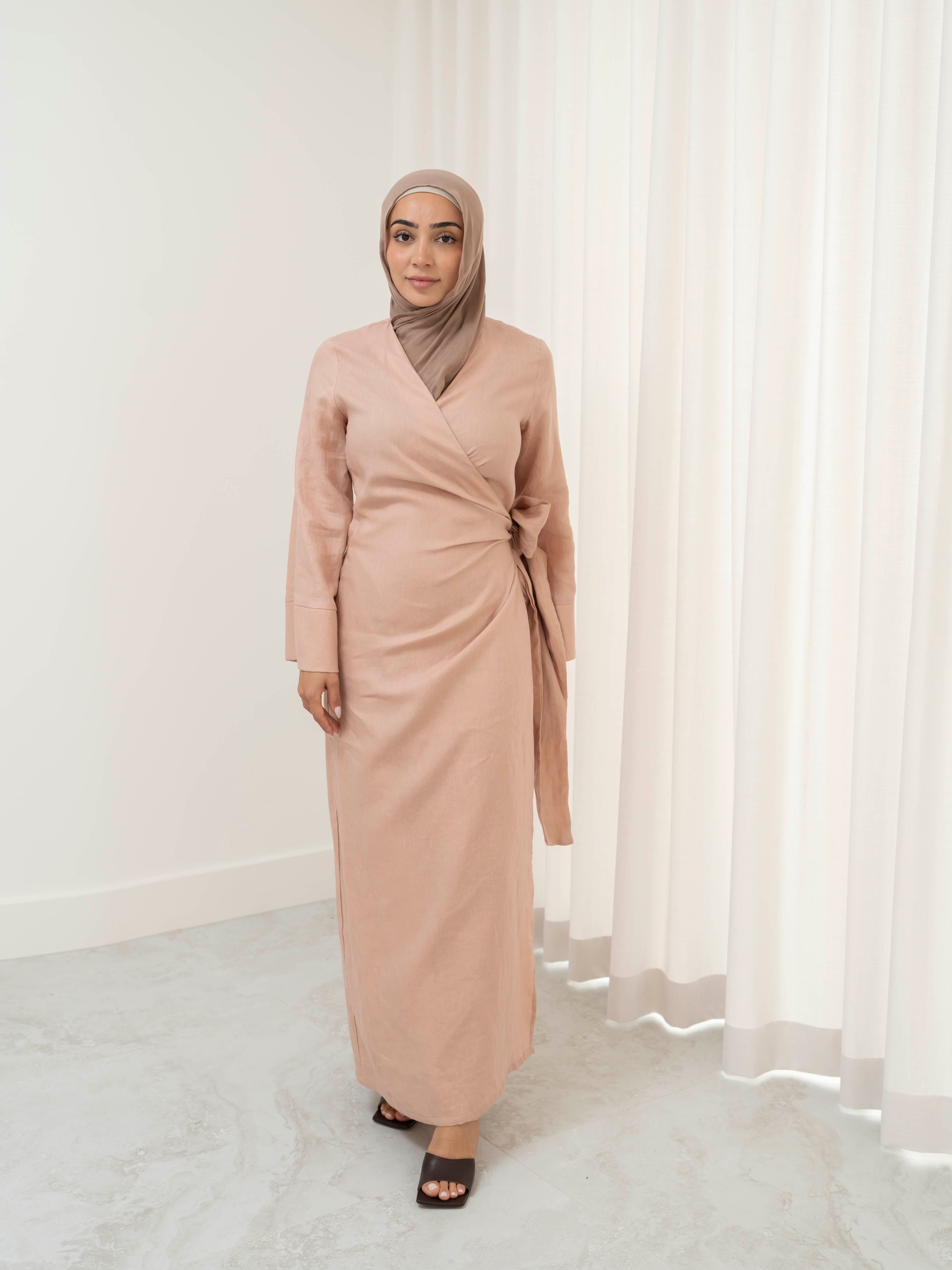 Model wearing the Linen Kimono Wrap featuring a relaxed silhouette in breathable linen fabric, styled as a wrap for a modest and effortless look.