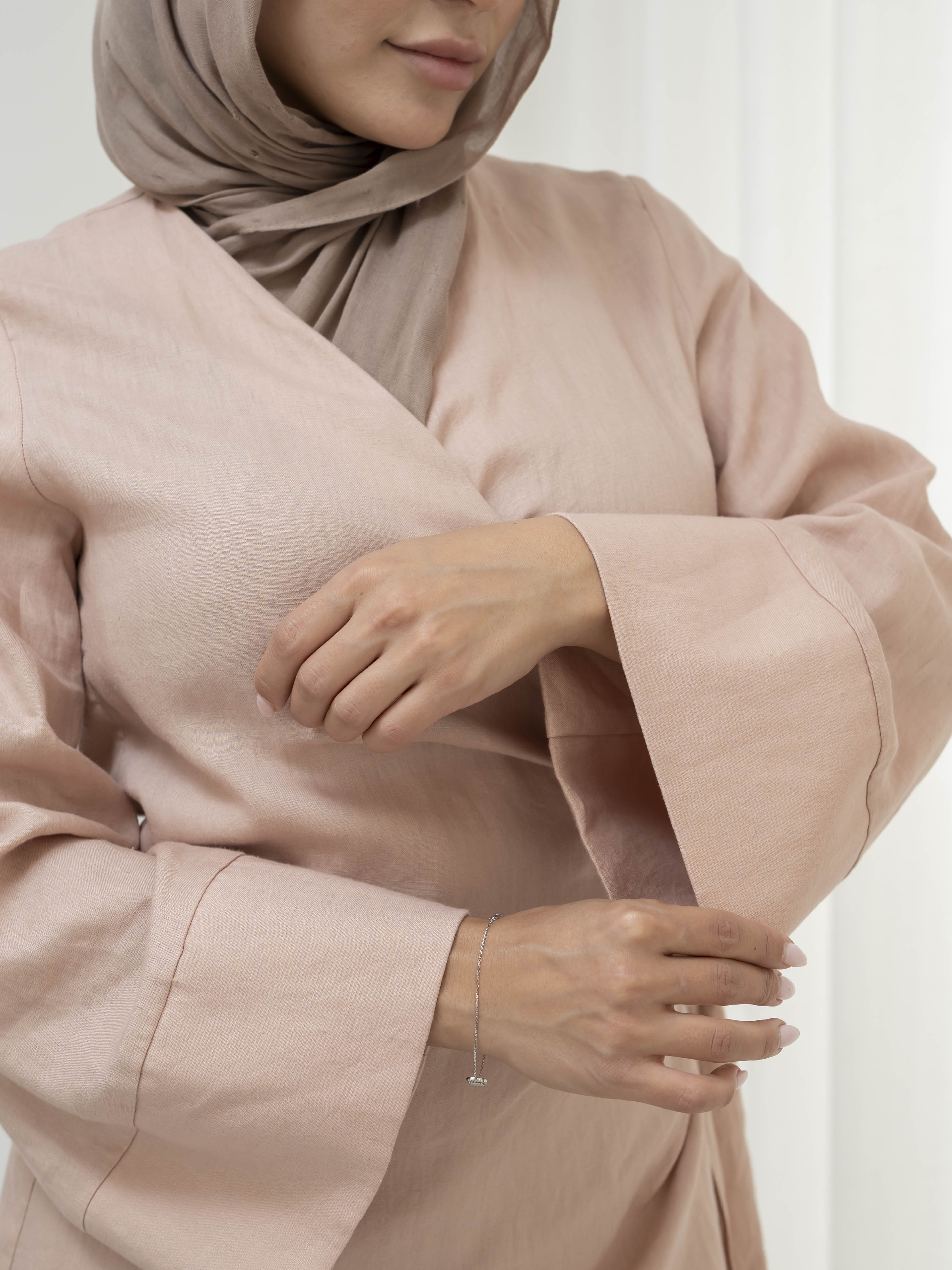 Model wearing the Linen Kimono Wrap featuring a relaxed silhouette in breathable linen fabric, styled as a wrap for a modest and effortless look.